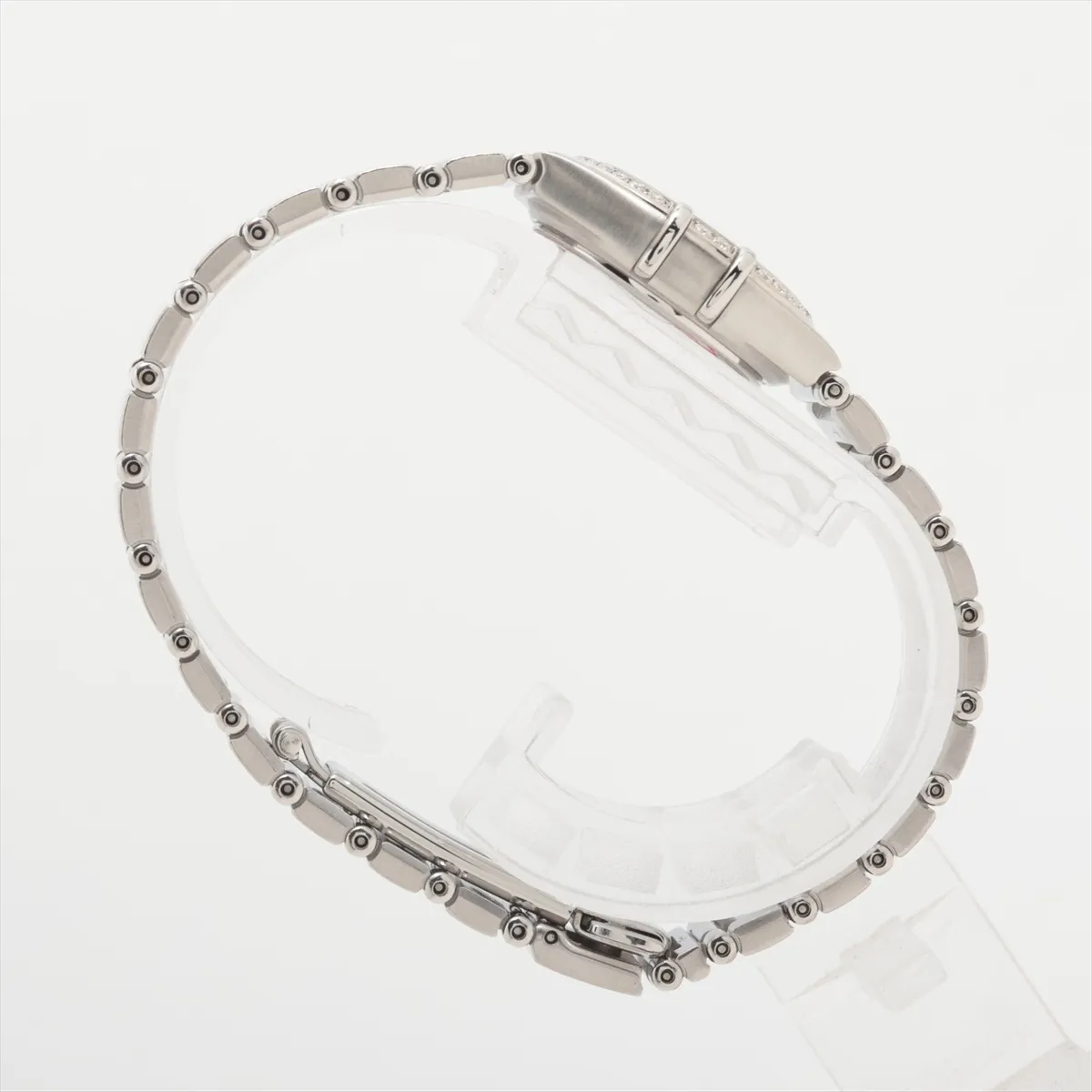 Steel bracelet watch with a pale shell-coloured dial and claw-style bezel detailing.