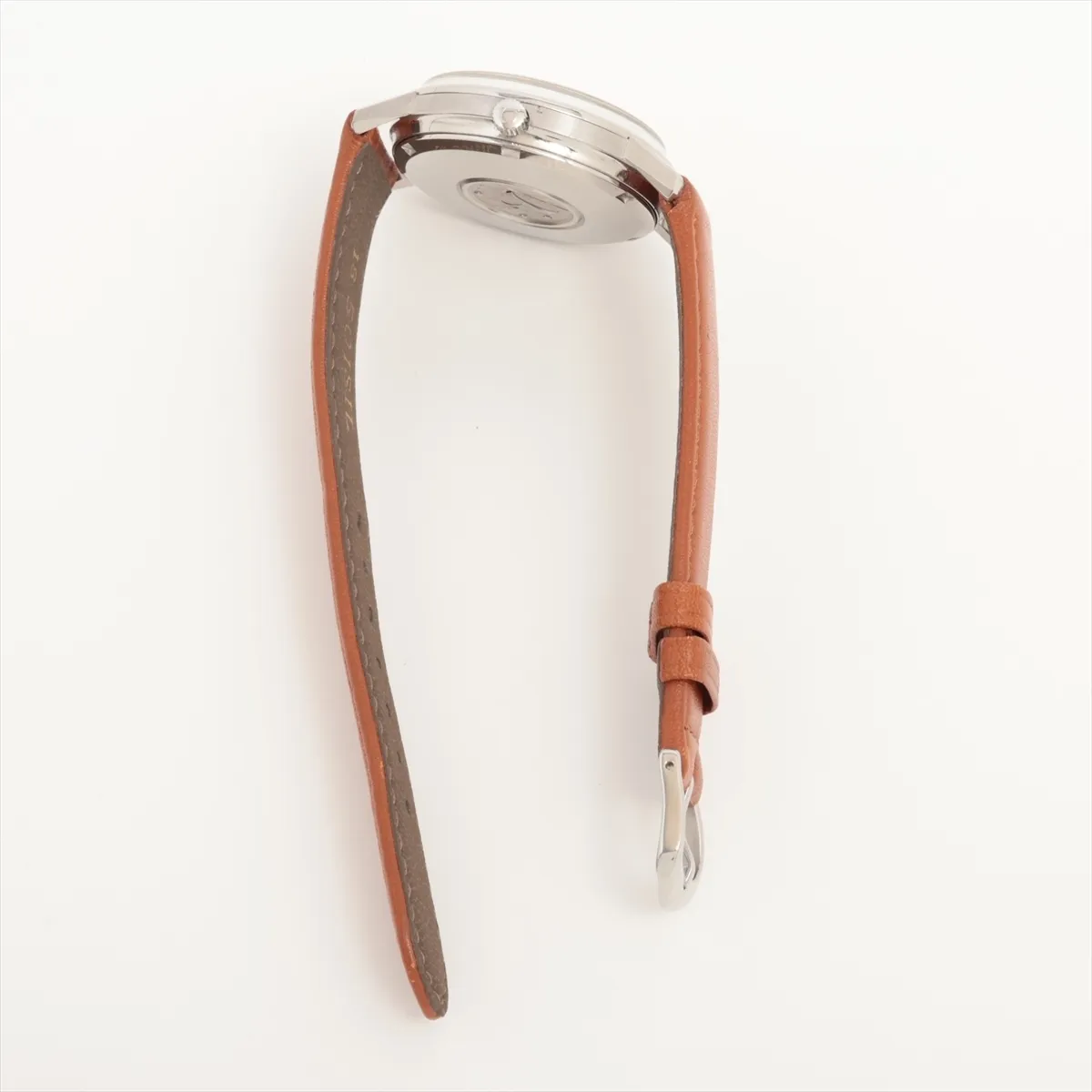 Product photograph of a round silver-dial watch on a dark leather strap.