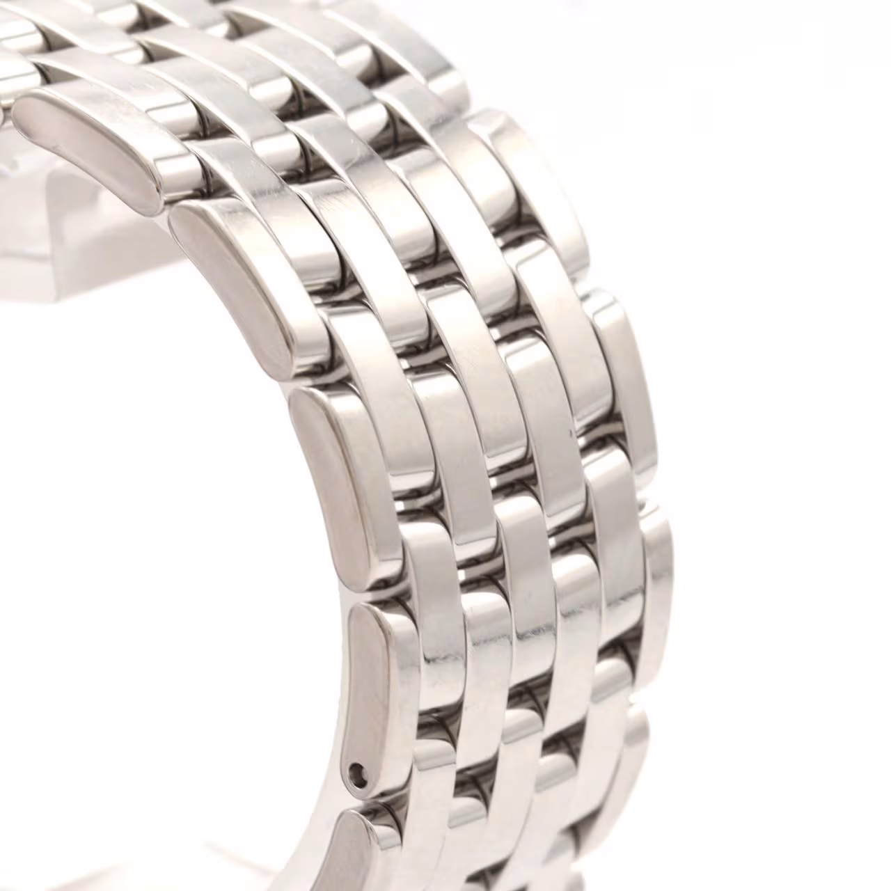 Dress wristwatch with a round case, slim bezel and stainless steel bracelet.