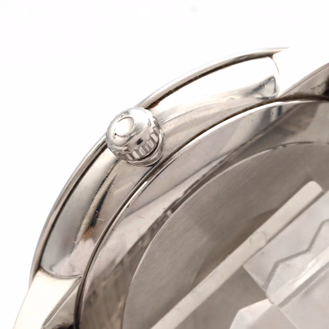Dress wristwatch with a round case, slim bezel and stainless steel bracelet.