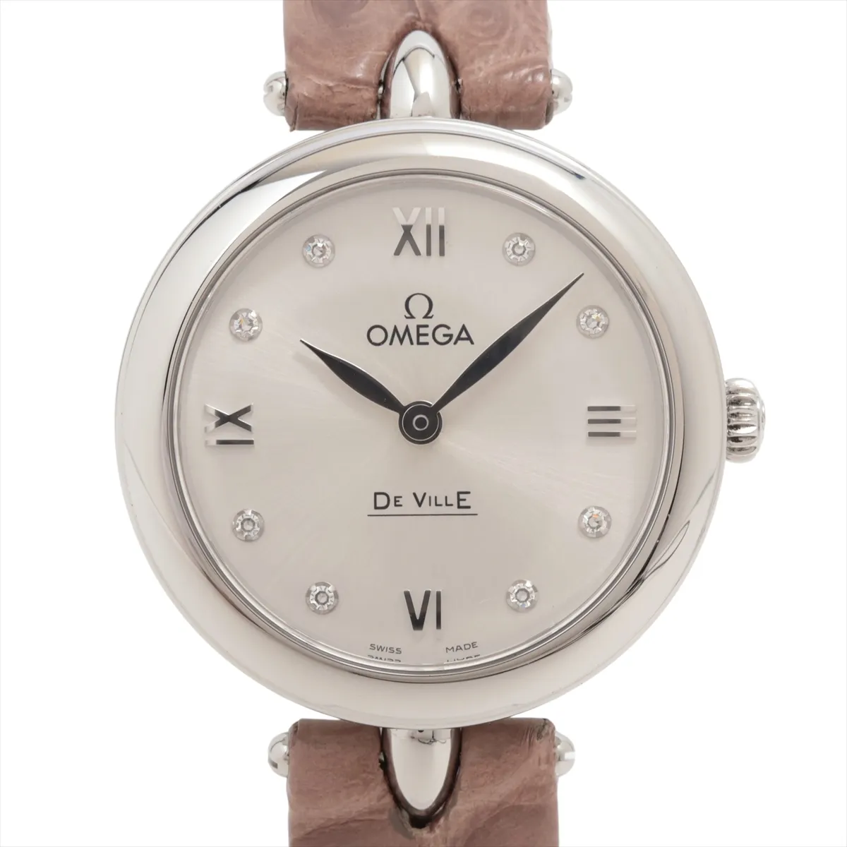 Small round watch with a pale dial and a dark leather strap.