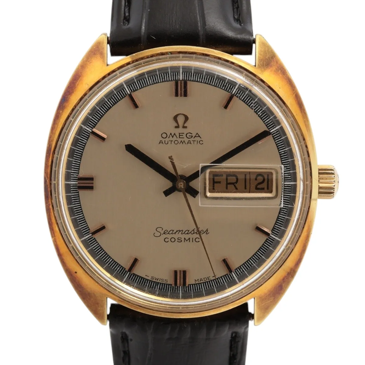 Vintage champagne-dial automatic watch in a gold-tone case on a strap, dial facing the camera