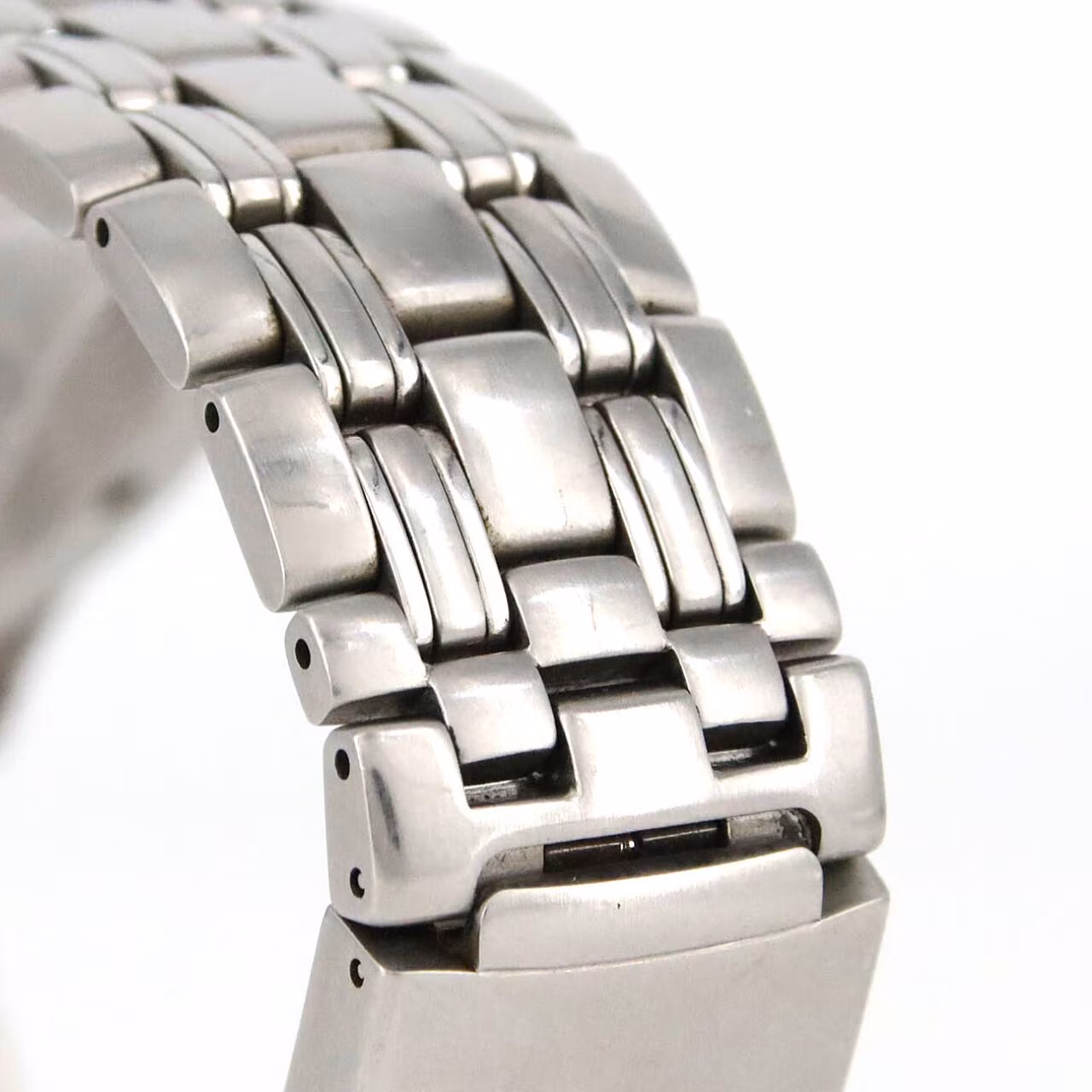Steel diver's watch with blue wave-pattern dial, blue bezel and steel bracelet.
