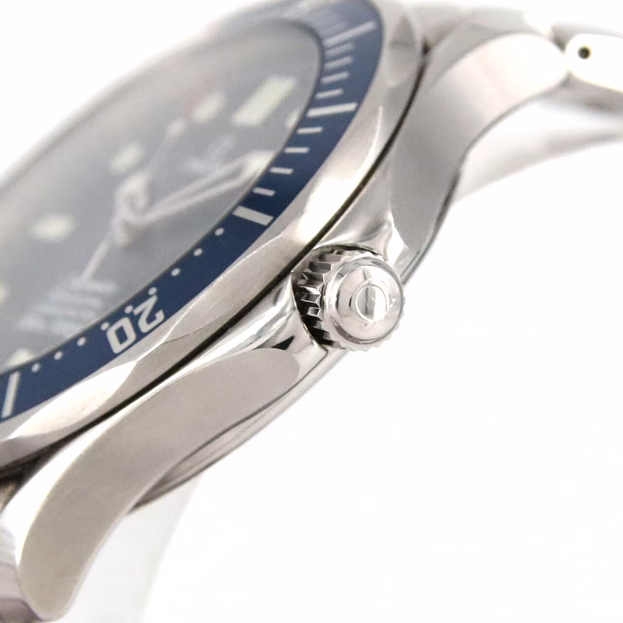 Steel diver's watch with blue wave-pattern dial, blue bezel and steel bracelet.