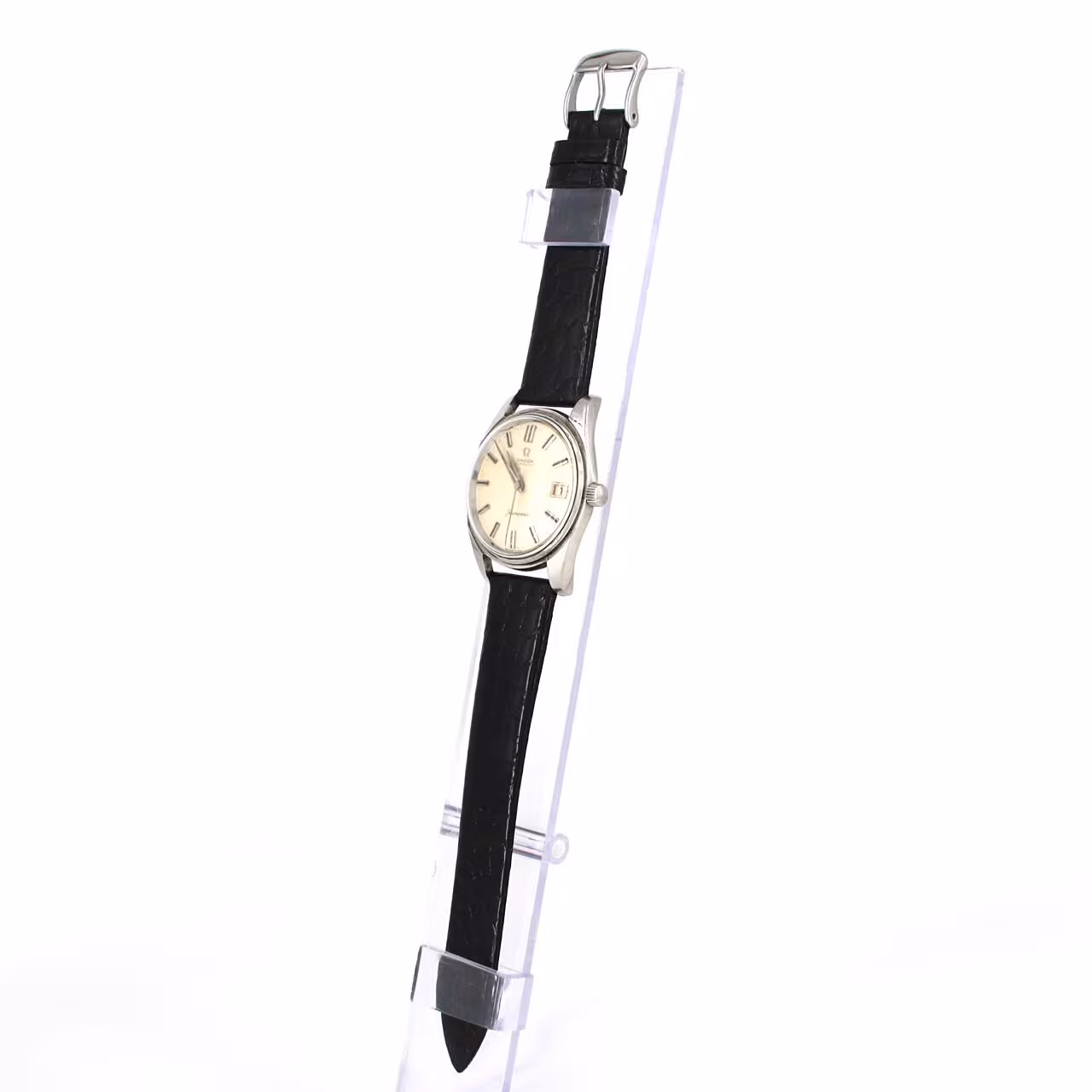 Vintage round wristwatch with warm silver dial, applied baton markers and slim steel case.