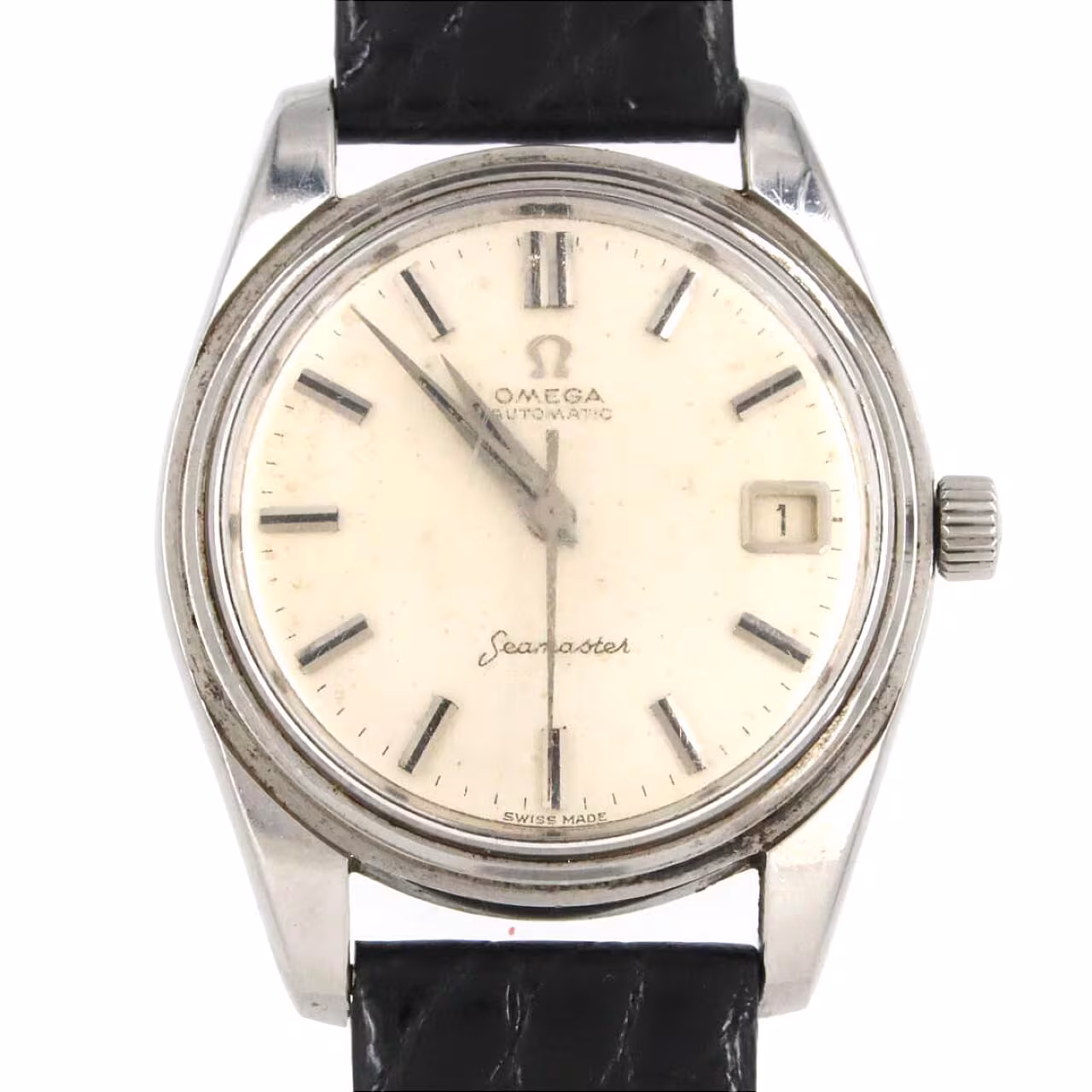 Vintage round wristwatch with warm silver dial, applied baton markers and slim steel case.
