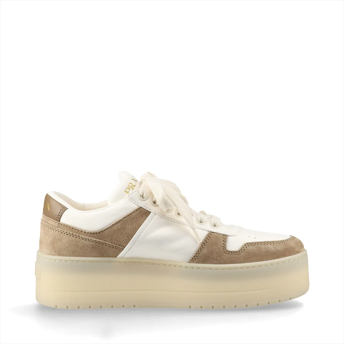 Thick-soled platform shoe in white and brown with a triangular metal logo plaque on the side.
