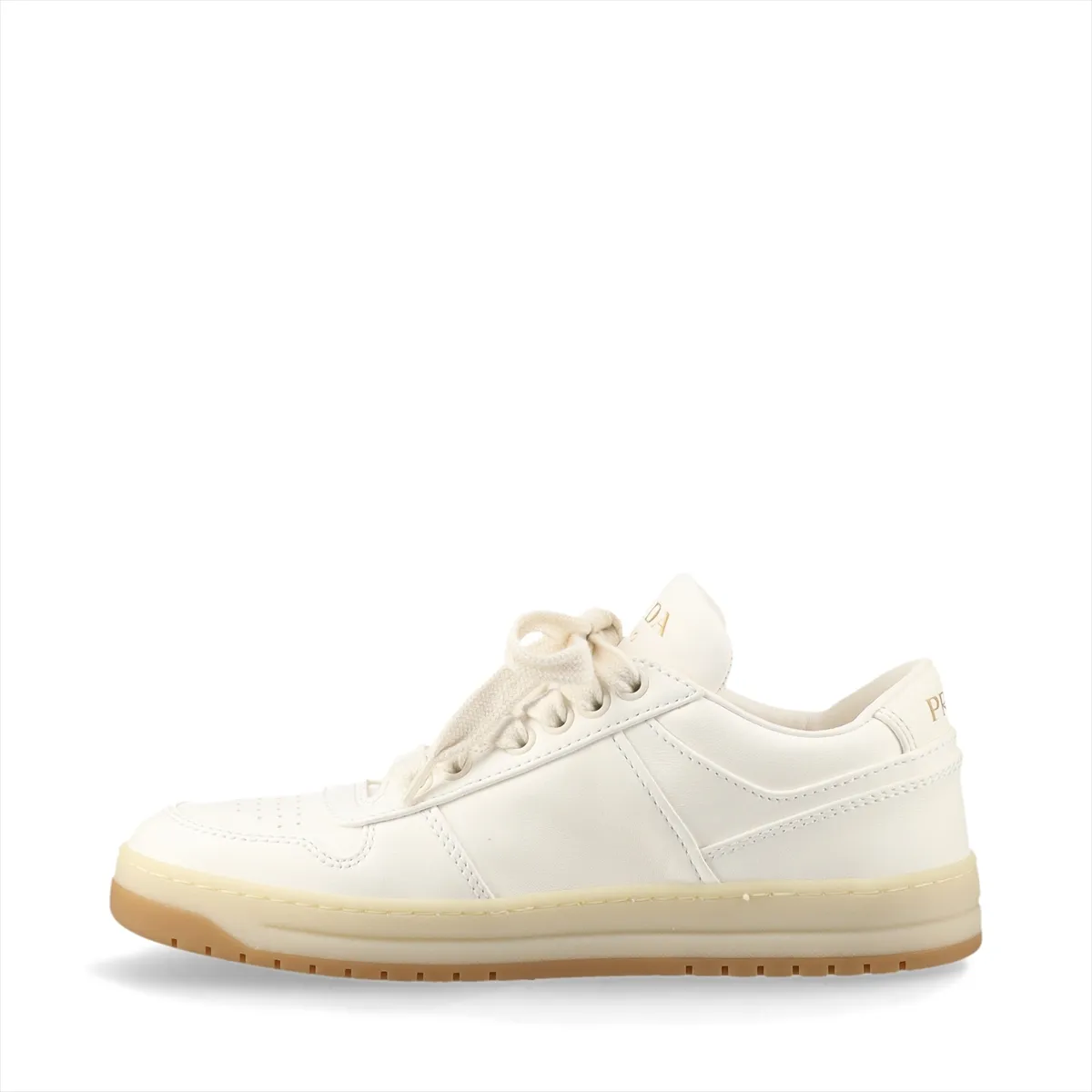 Ivory leather low-top sneakers with a small triangular metal plaque on the side and white soles.