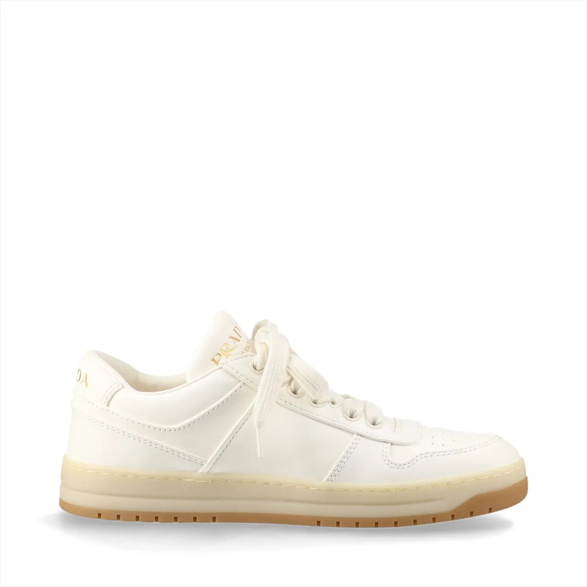Ivory leather low-top sneakers with a small triangular metal plaque on the side and white soles.