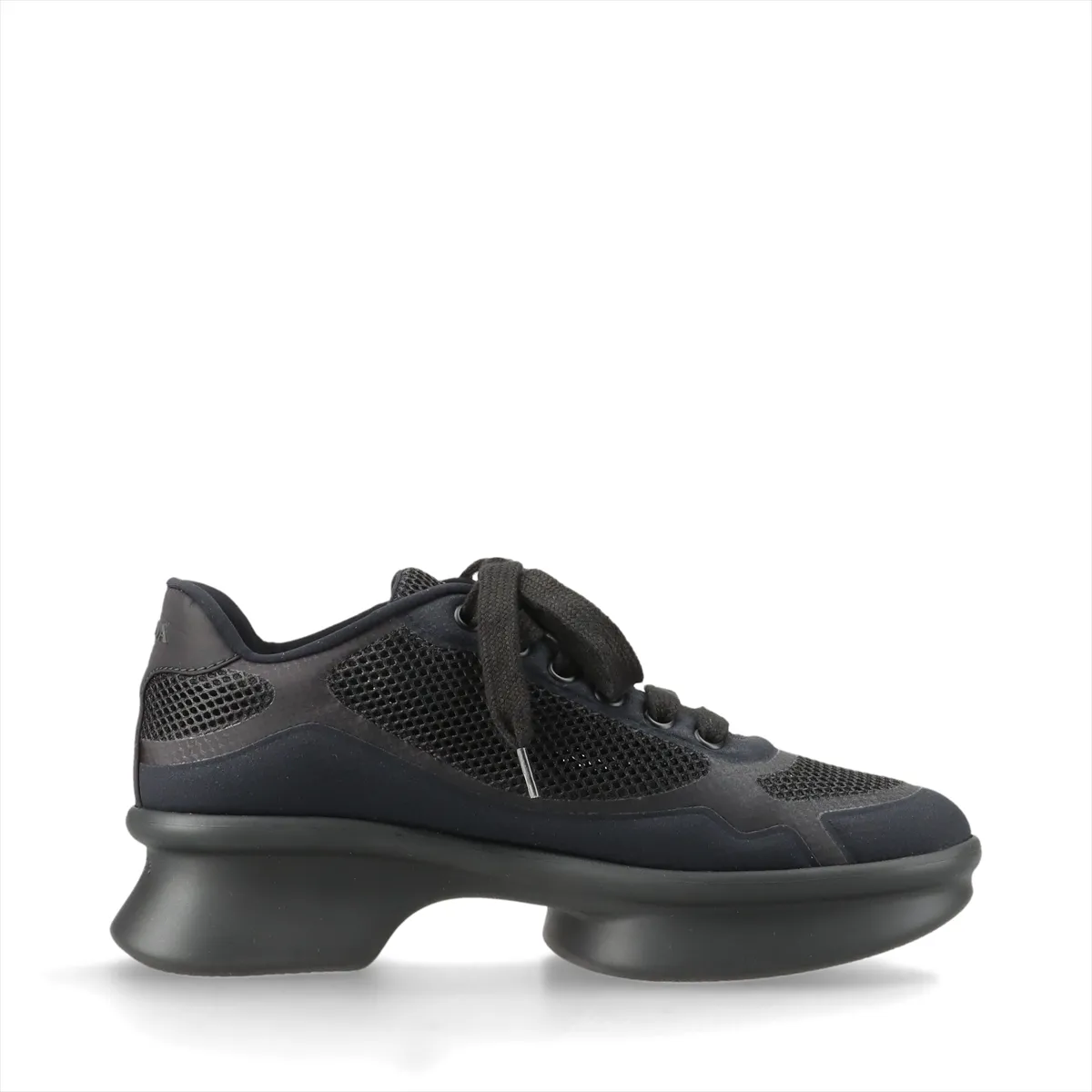 Dark navy platform sneaker with black trim, mesh panel and small triangle metal plaque.