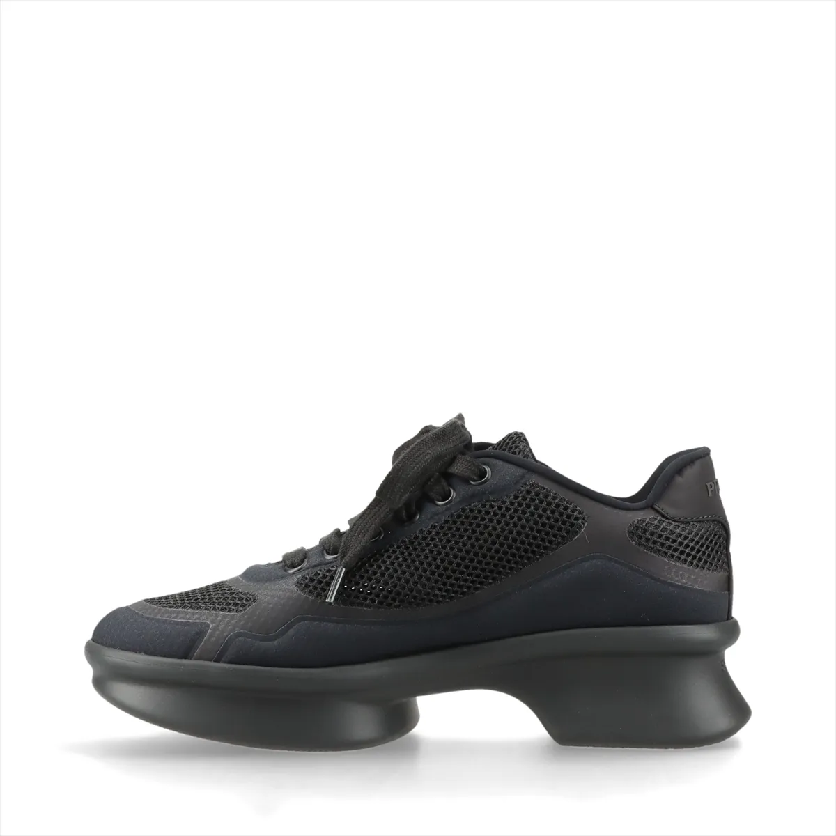 Dark navy platform sneaker with black trim, mesh panel and small triangle metal plaque.