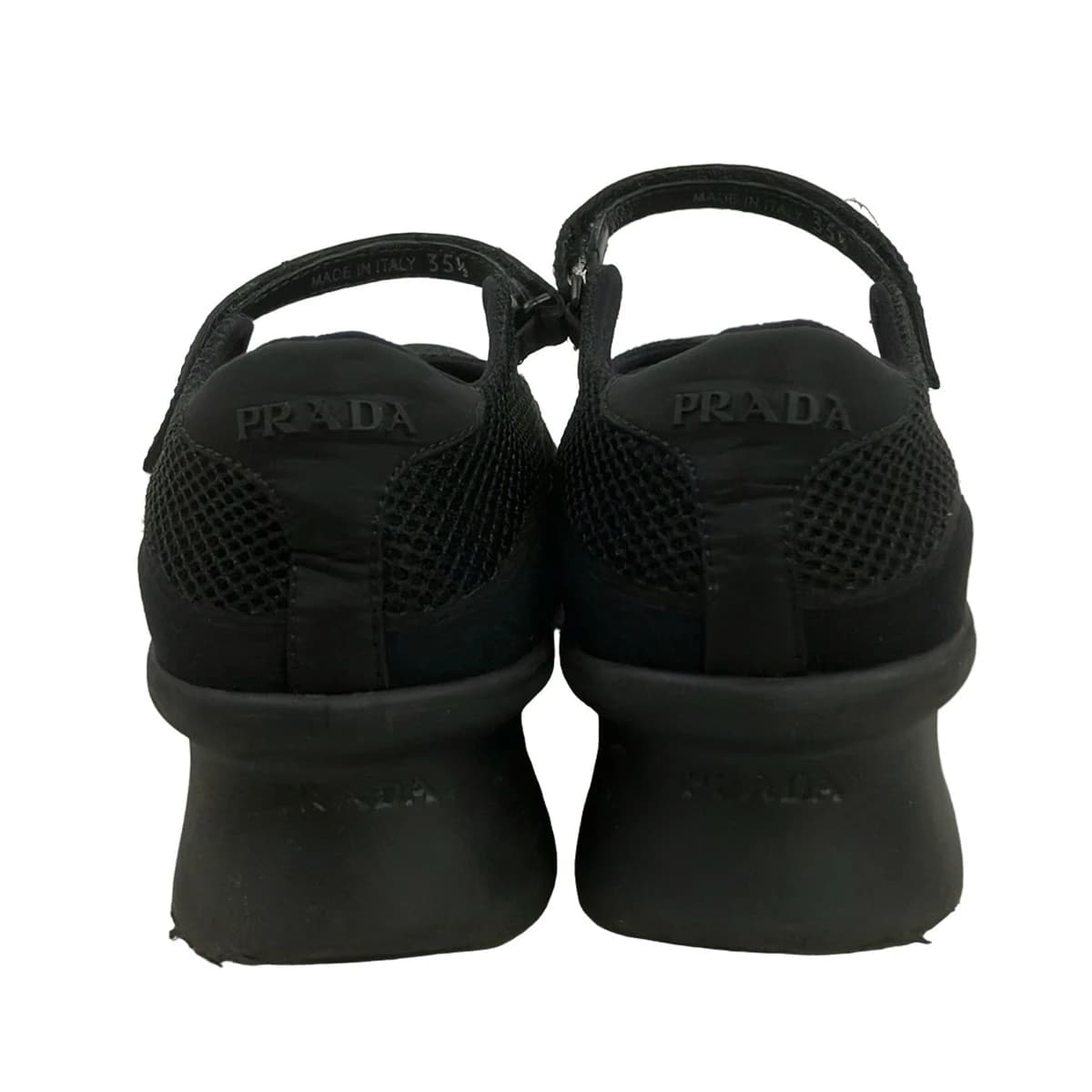 Black mesh low-top footwear, side view