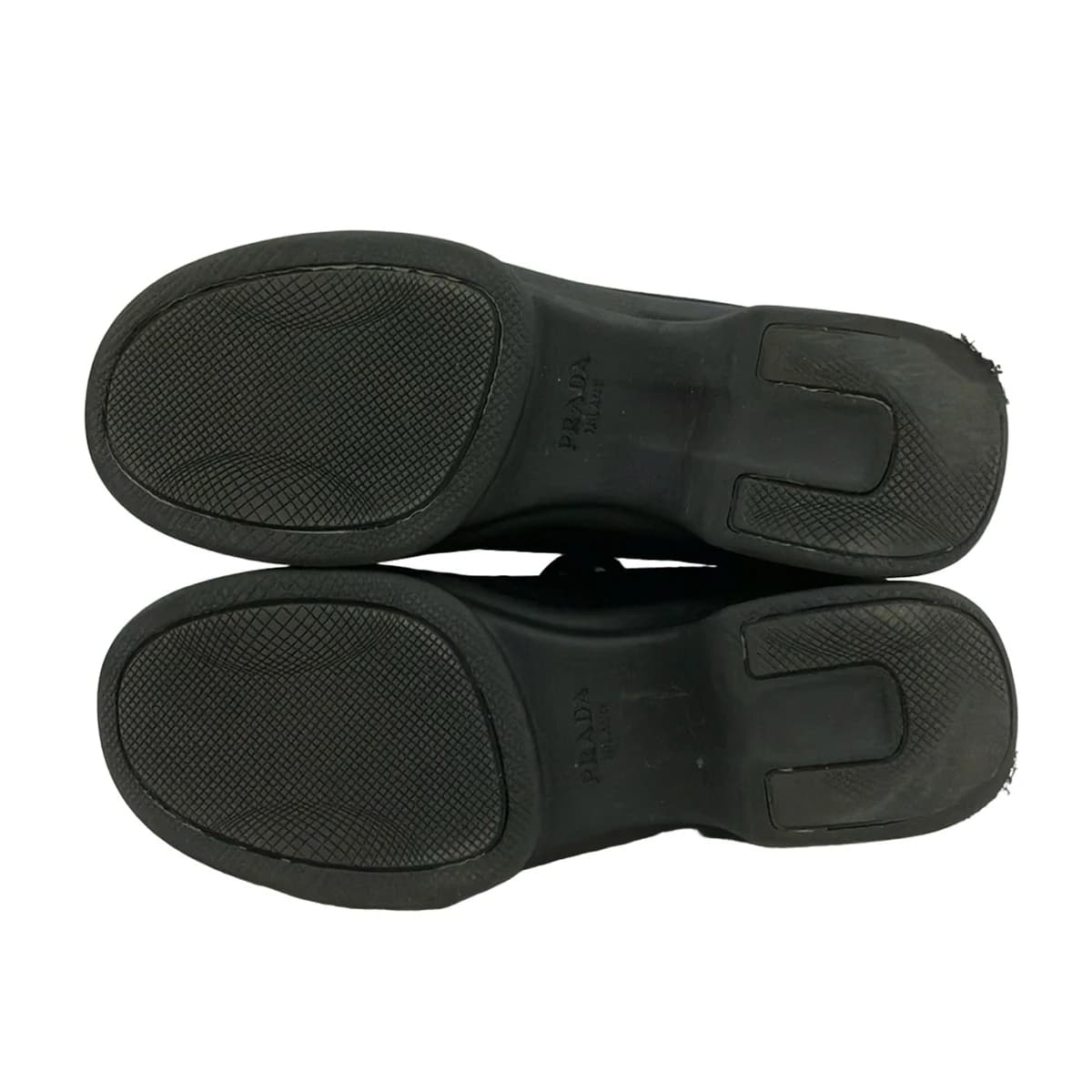 Black mesh low-top footwear, side view