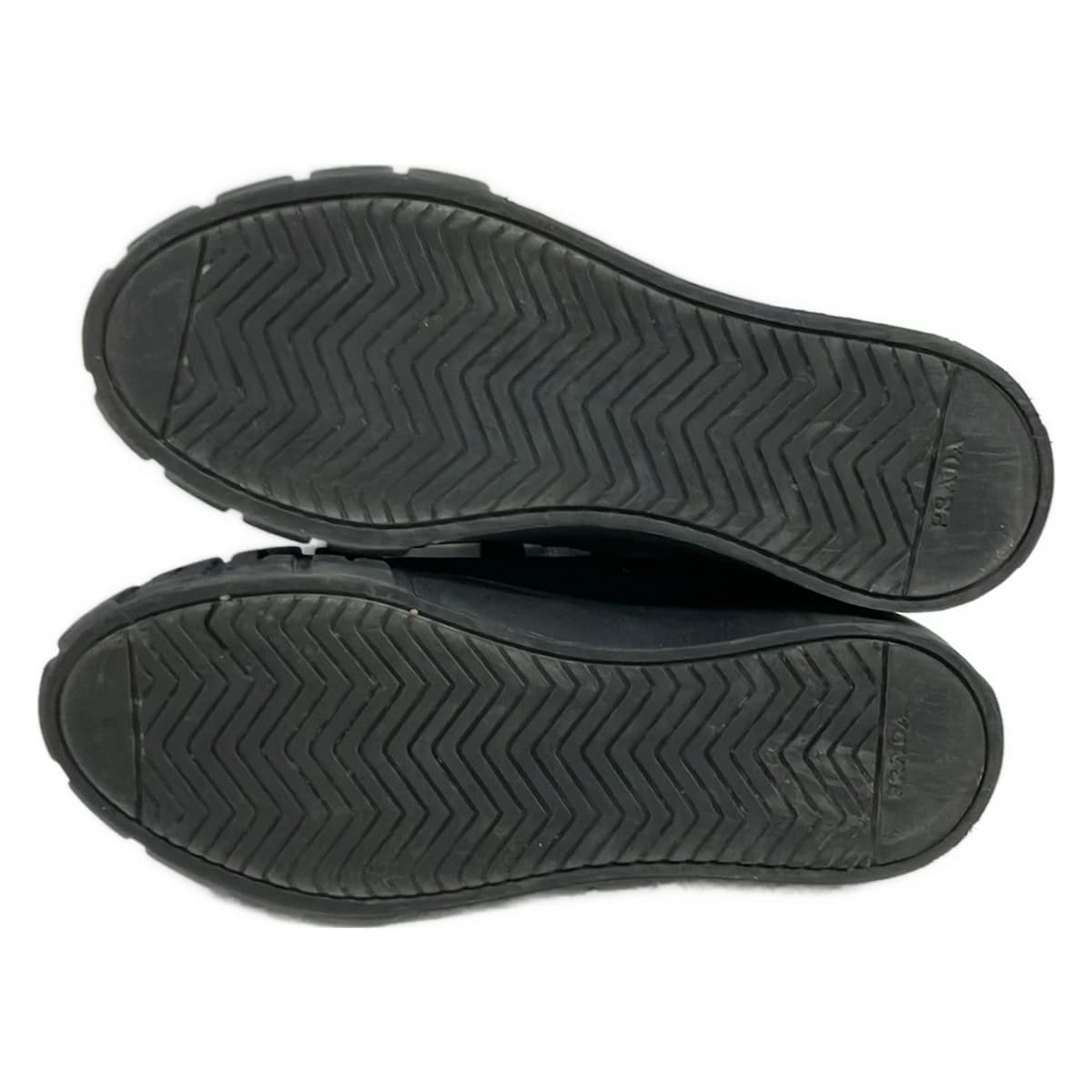 Black low-top lace-up footwear, side view