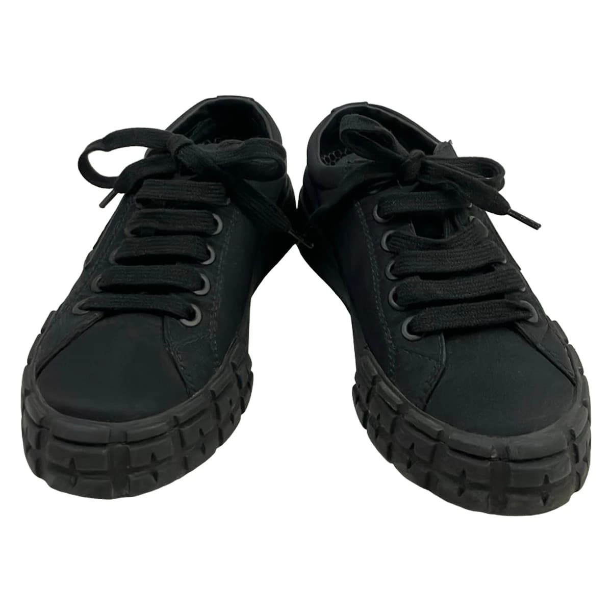 Black low-top lace-up footwear, side view