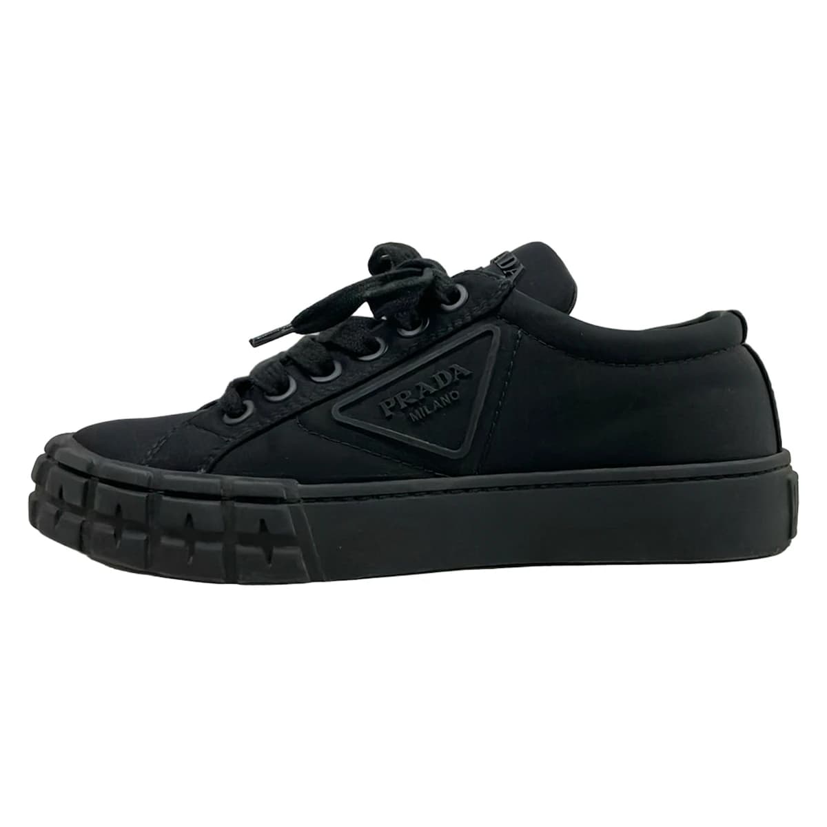 Black low-top lace-up footwear, side view