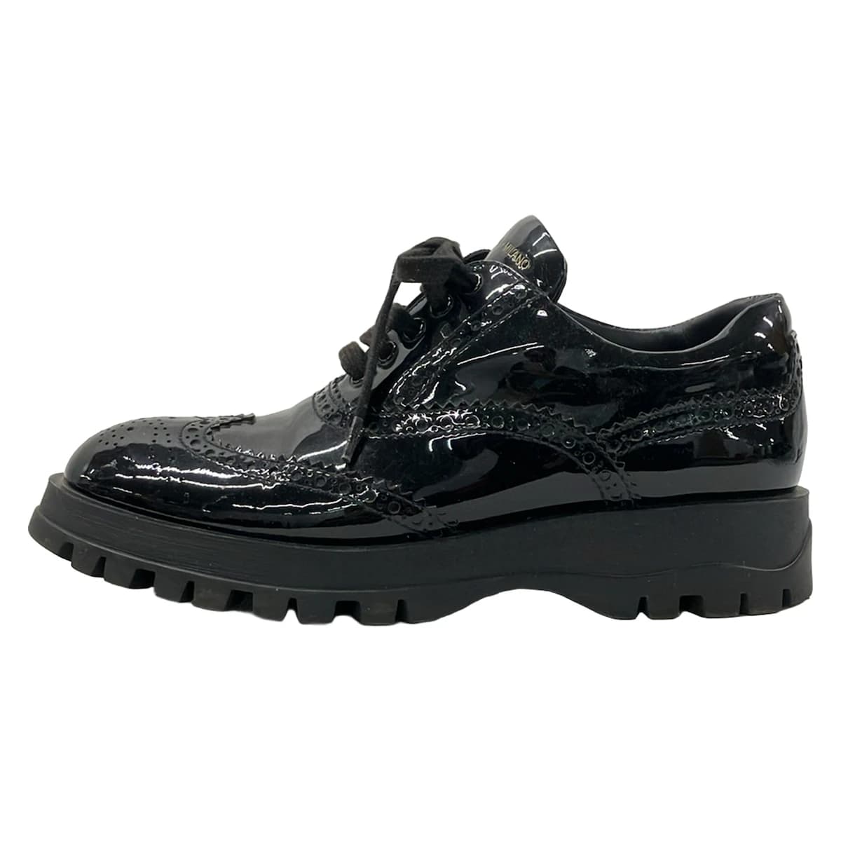 Pair of black leather low-top shoes with laces, shown side on.
