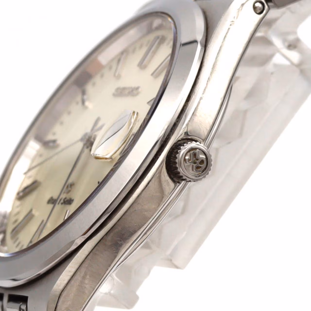 Stainless steel wristwatch with a plain dial, slim hands and steel bracelet.