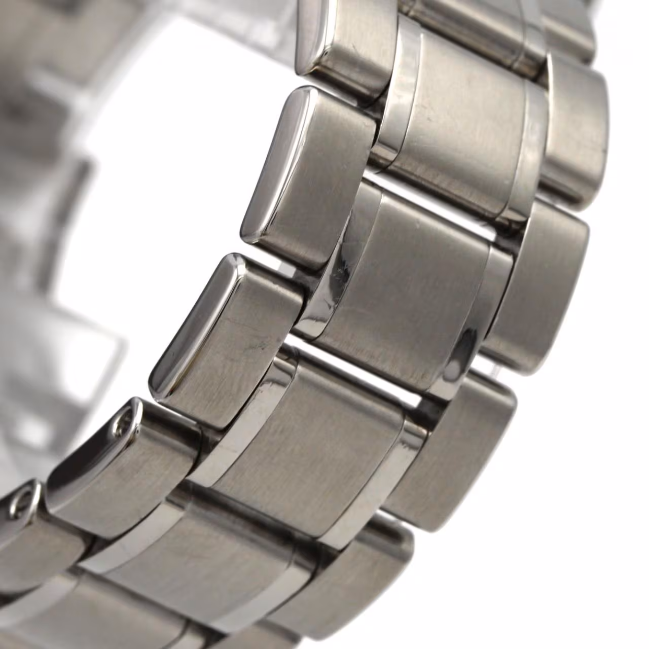 Stainless steel wristwatch with a light dial, baton hands and a matching bracelet.
