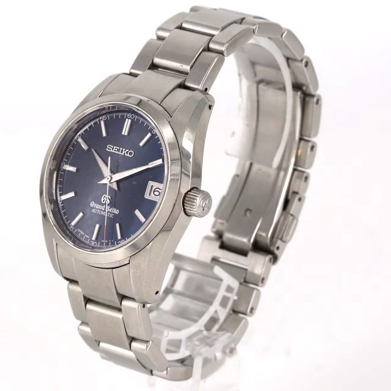 Stainless steel automatic wristwatch with a pale dial, baton markers, date window and steel bracelet.