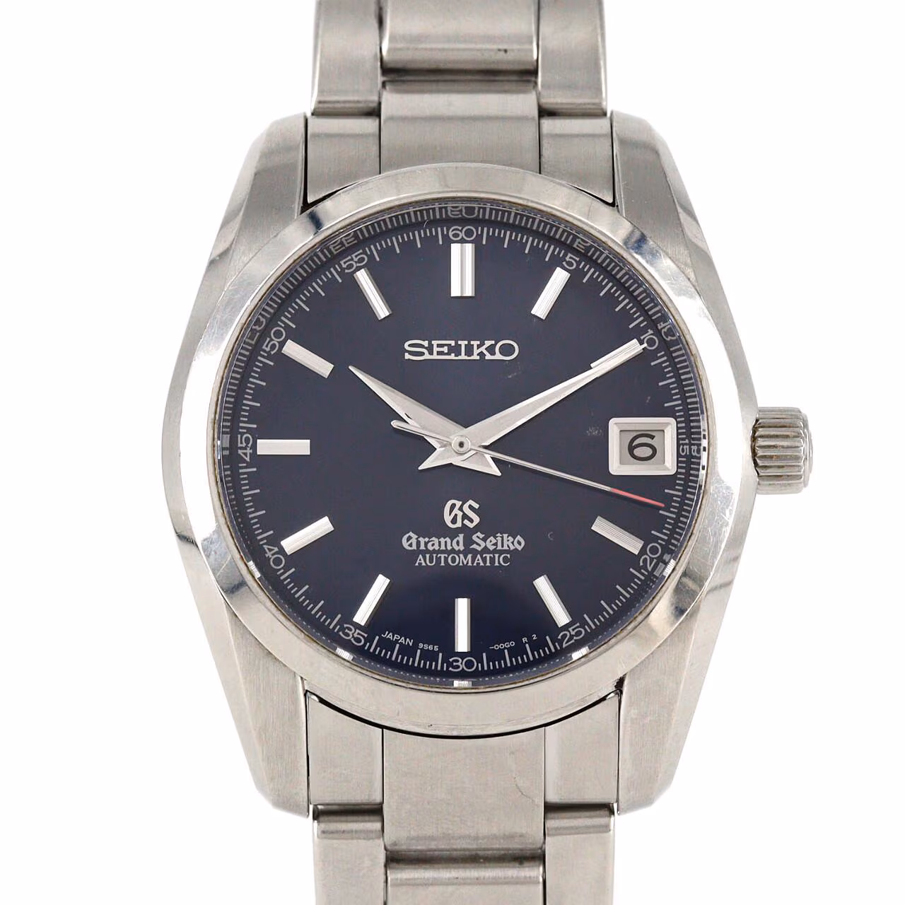 Stainless steel automatic wristwatch with a pale dial, baton markers, date window and steel bracelet.