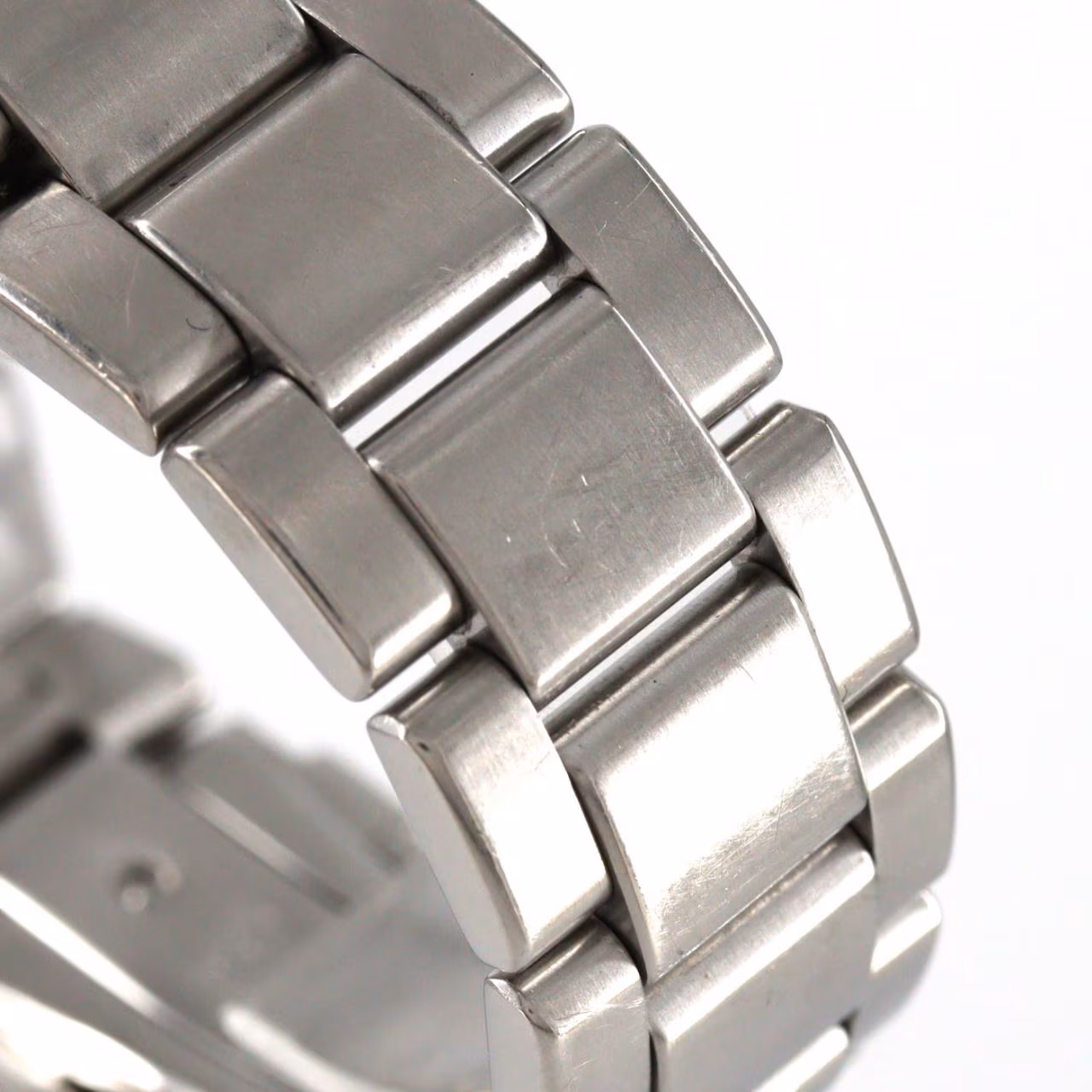 Stainless steel automatic wristwatch with a pale dial, baton markers, date window and steel bracelet.