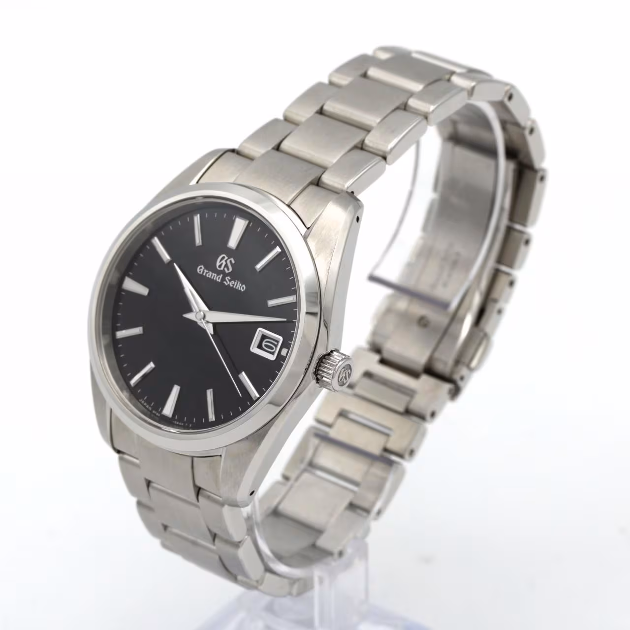 Stainless steel wristwatch with a light dial, baton markers and a matching steel bracelet.