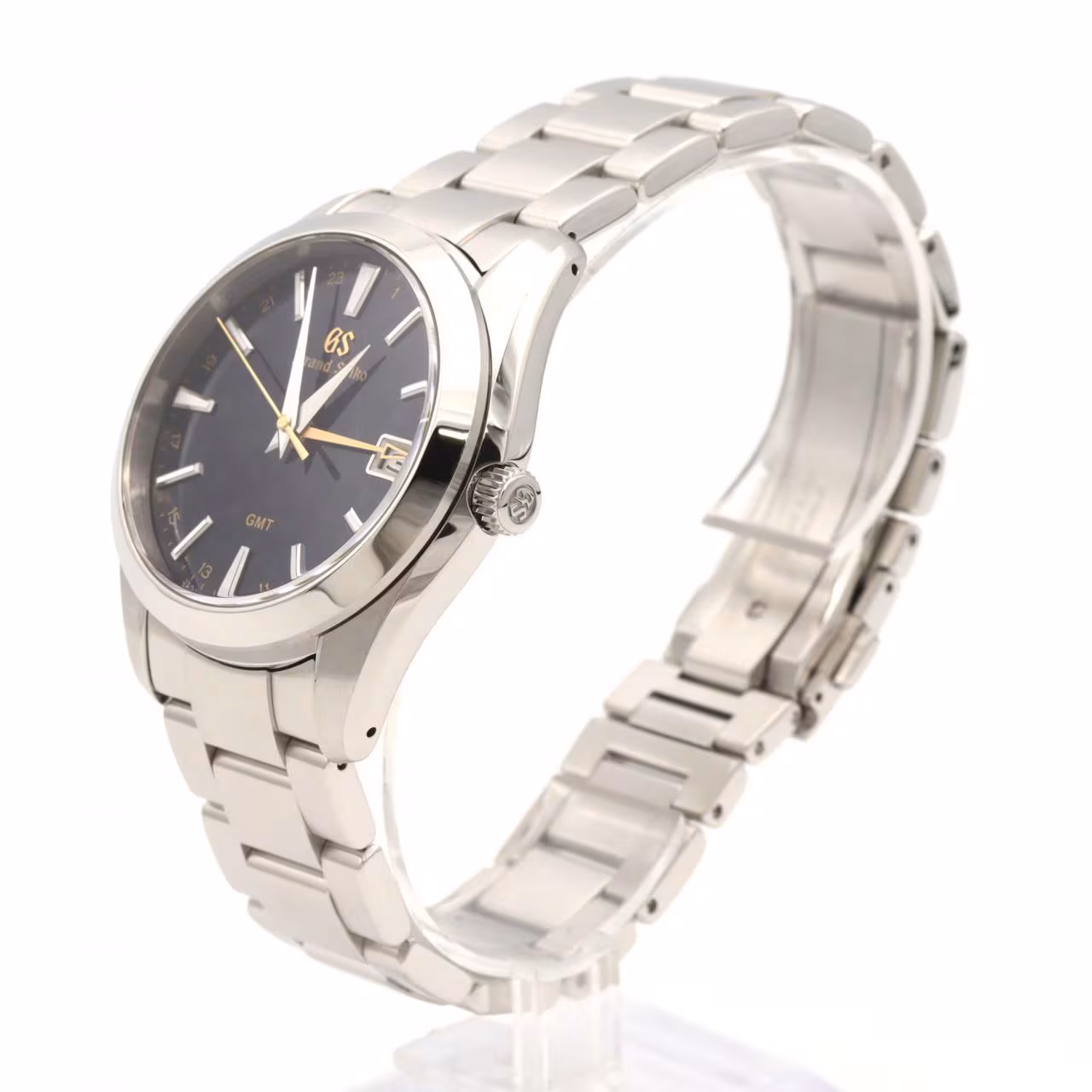 Stainless steel wristwatch with a blue GMT hand and date window on a steel bracelet.
