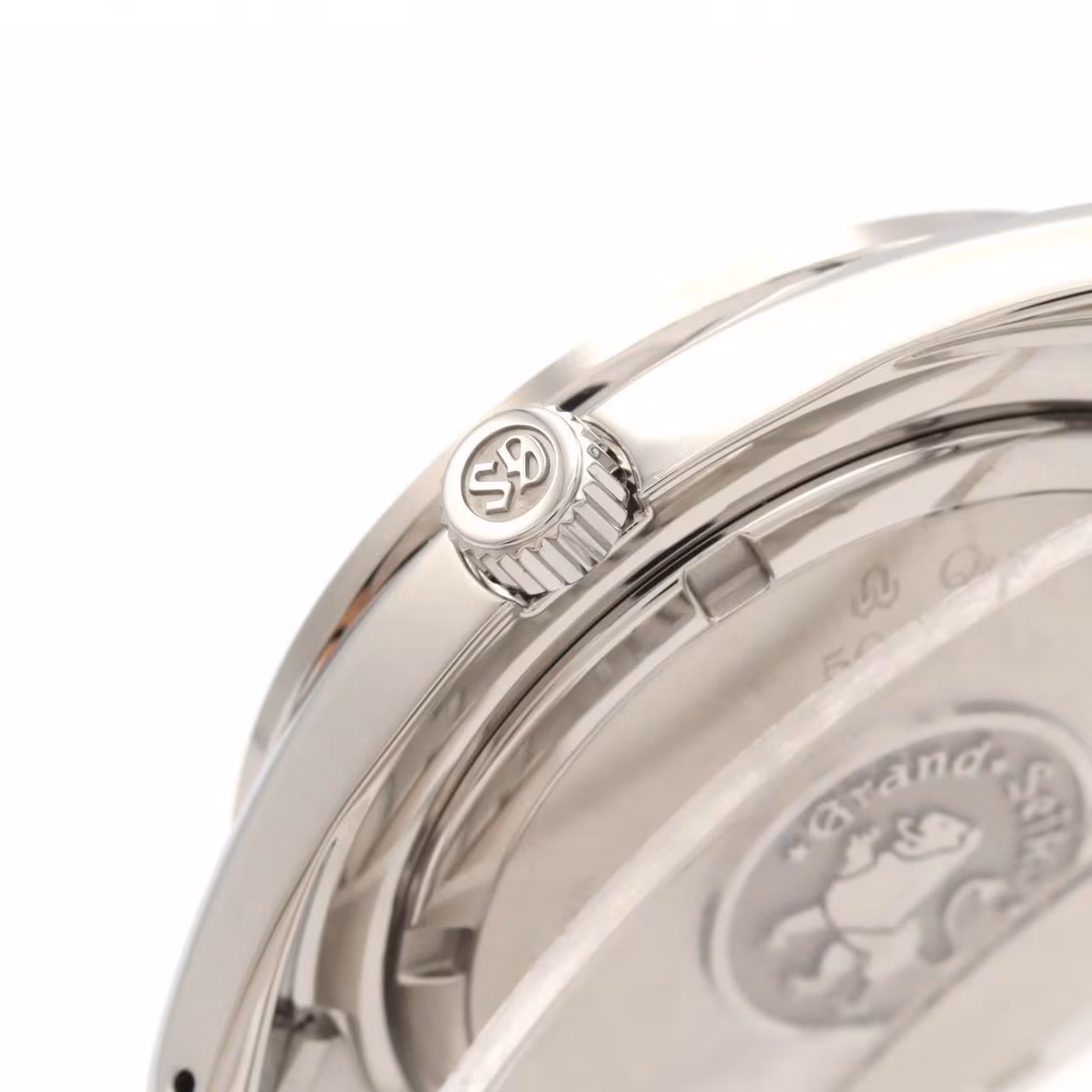 Stainless steel wristwatch with a blue GMT hand and date window on a steel bracelet.
