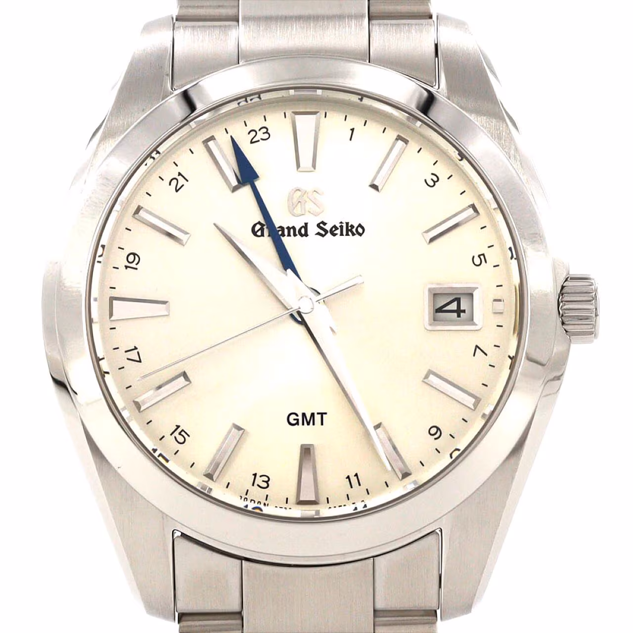 Stainless steel wristwatch with a light dial, blue GMT hand, date window and steel bracelet.