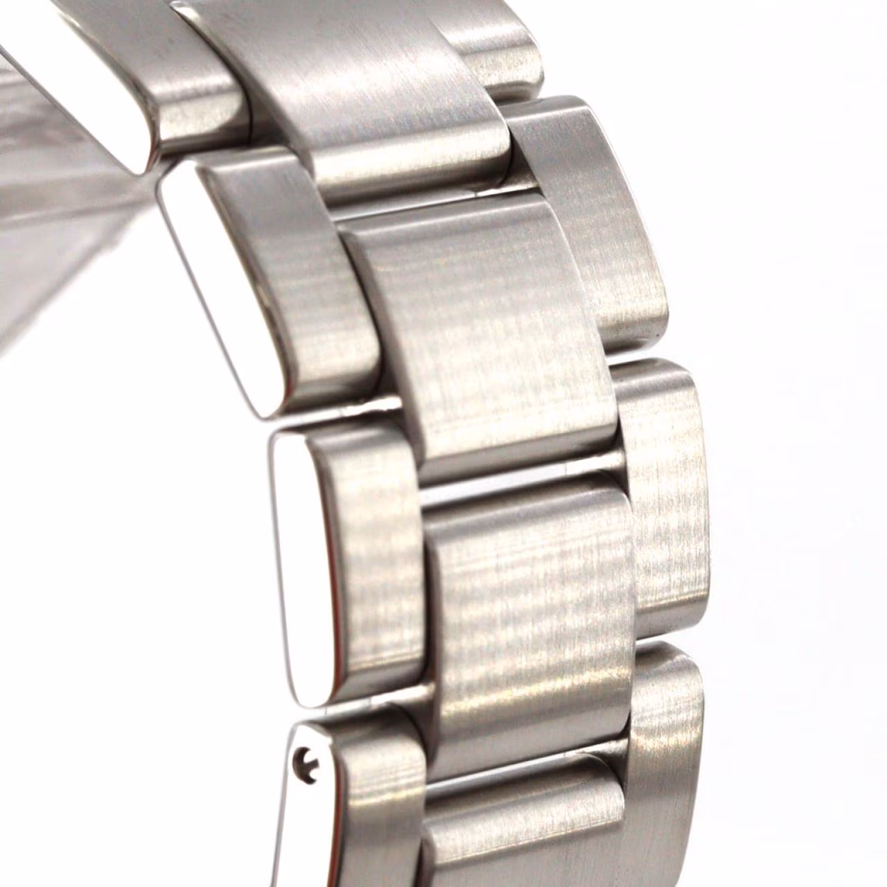 Stainless steel wristwatch with a light dial, blue GMT hand, date window and steel bracelet.