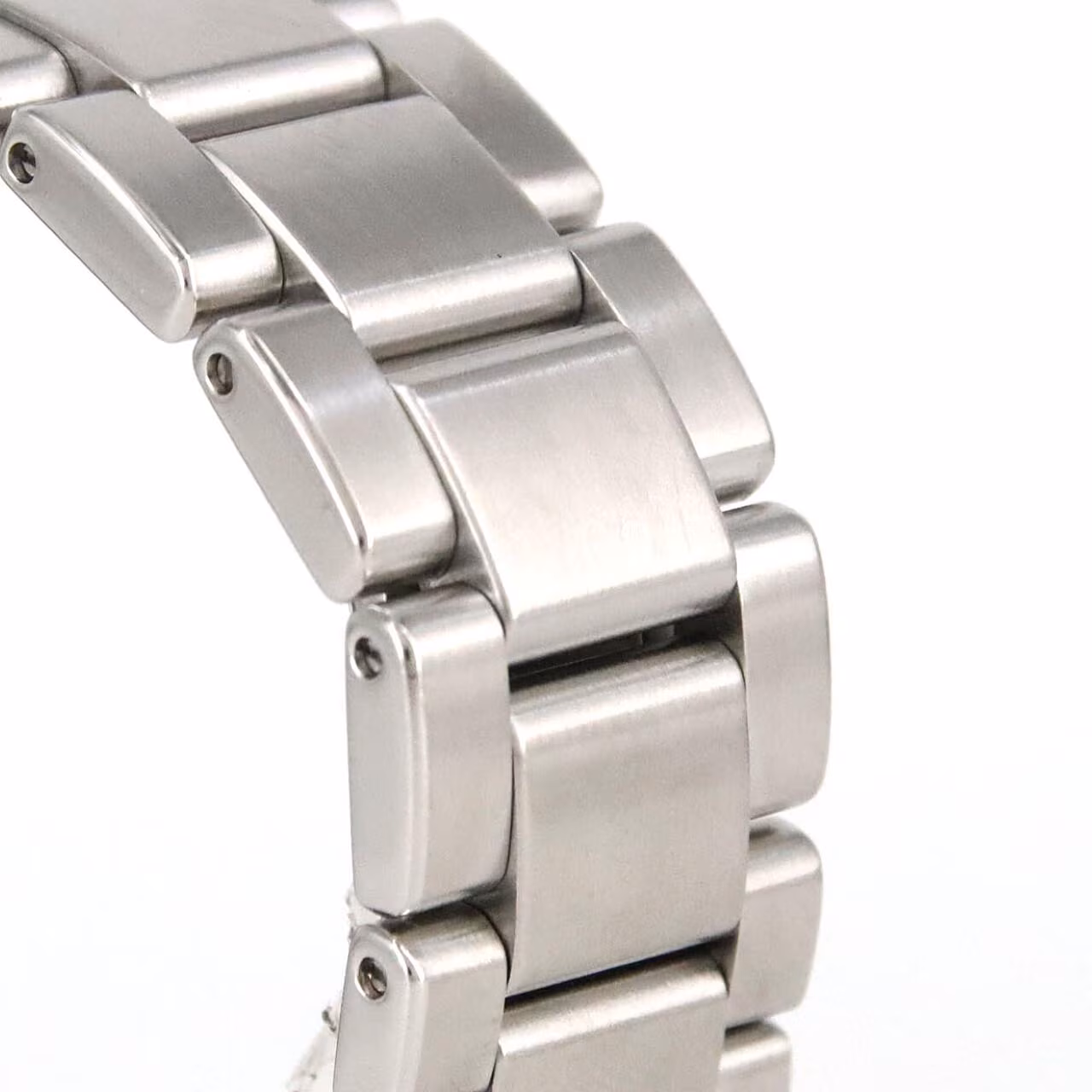 Stainless steel wristwatch with silver dial, blue-tipped GMT hand, date window and steel bracelet.