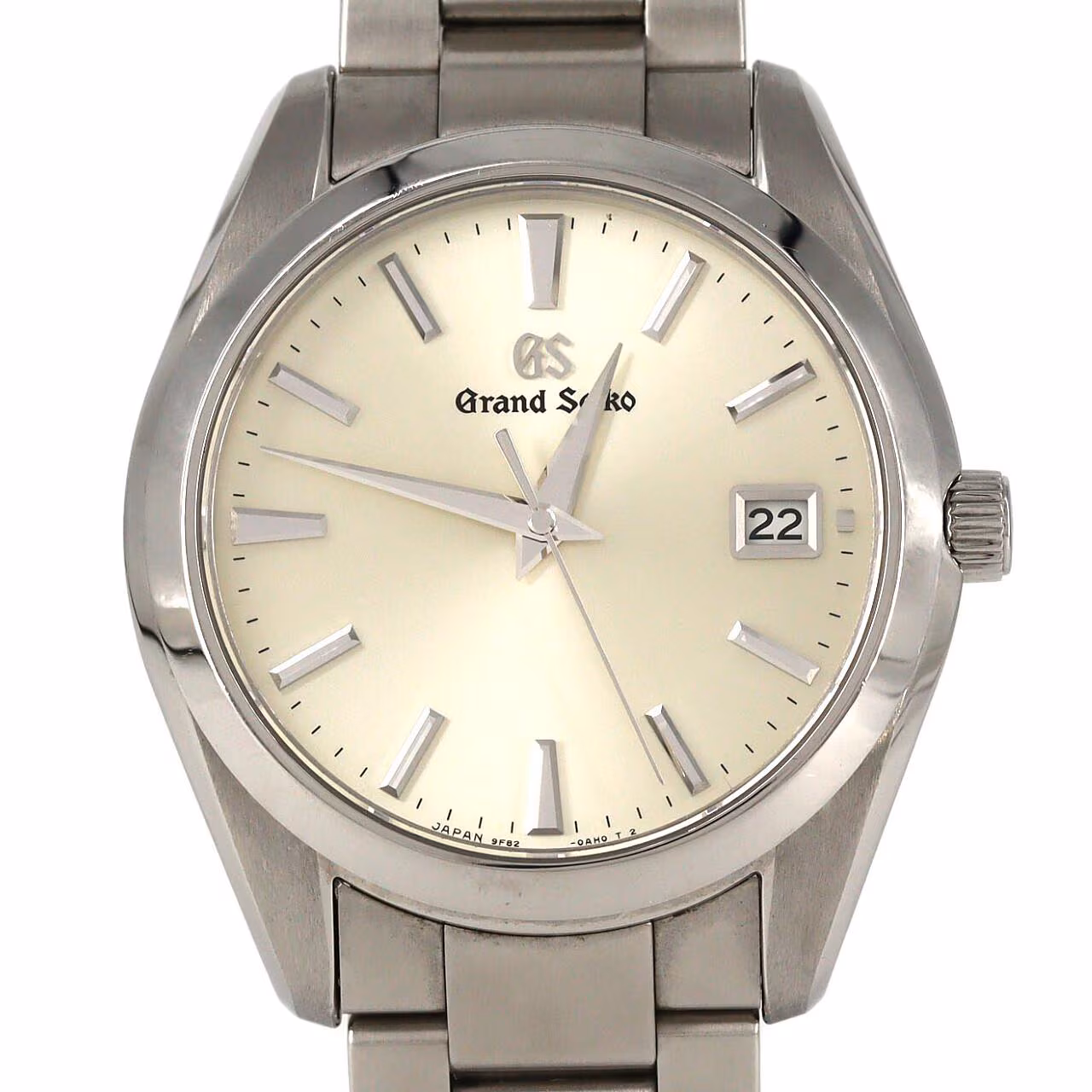 Stainless steel wristwatch with a bright dial and brushed steel bracelet.