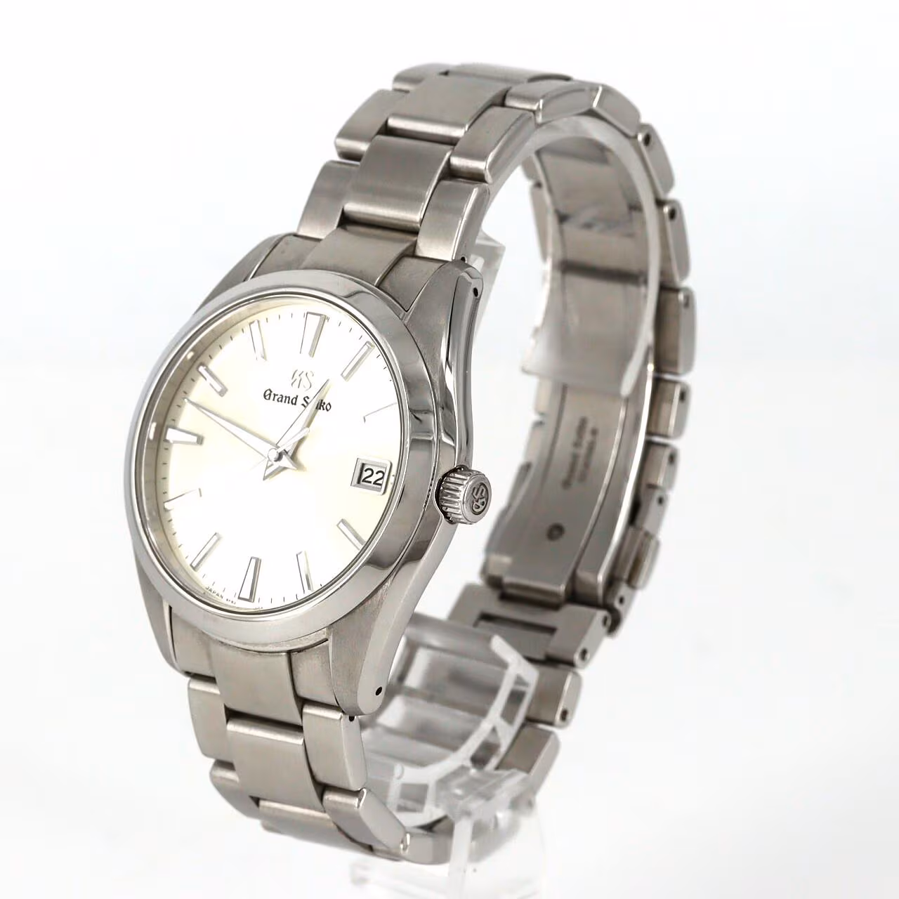 Stainless steel wristwatch with a bright dial and brushed steel bracelet.