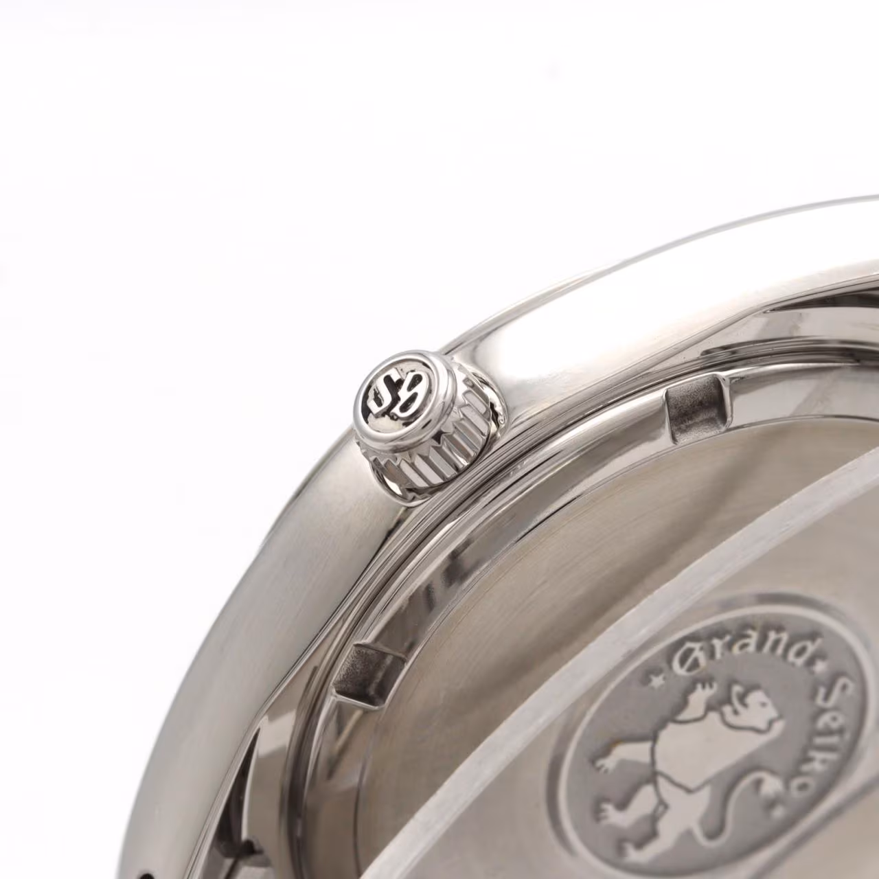 Stainless steel wristwatch with a white dial, applied markers and steel bracelet.