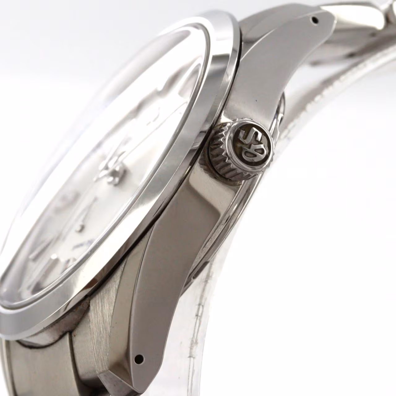 Stainless steel automatic wristwatch with a bracelet and a power reserve indicator on the dial.
