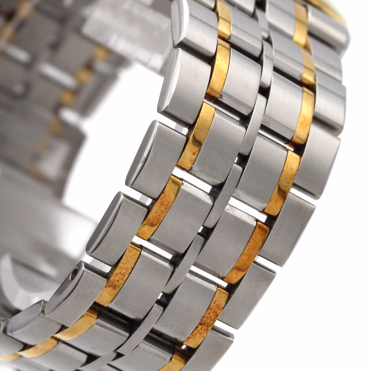 Two-tone wristwatch with steel and gold bracelet links, pale dial, baton markers and date window.