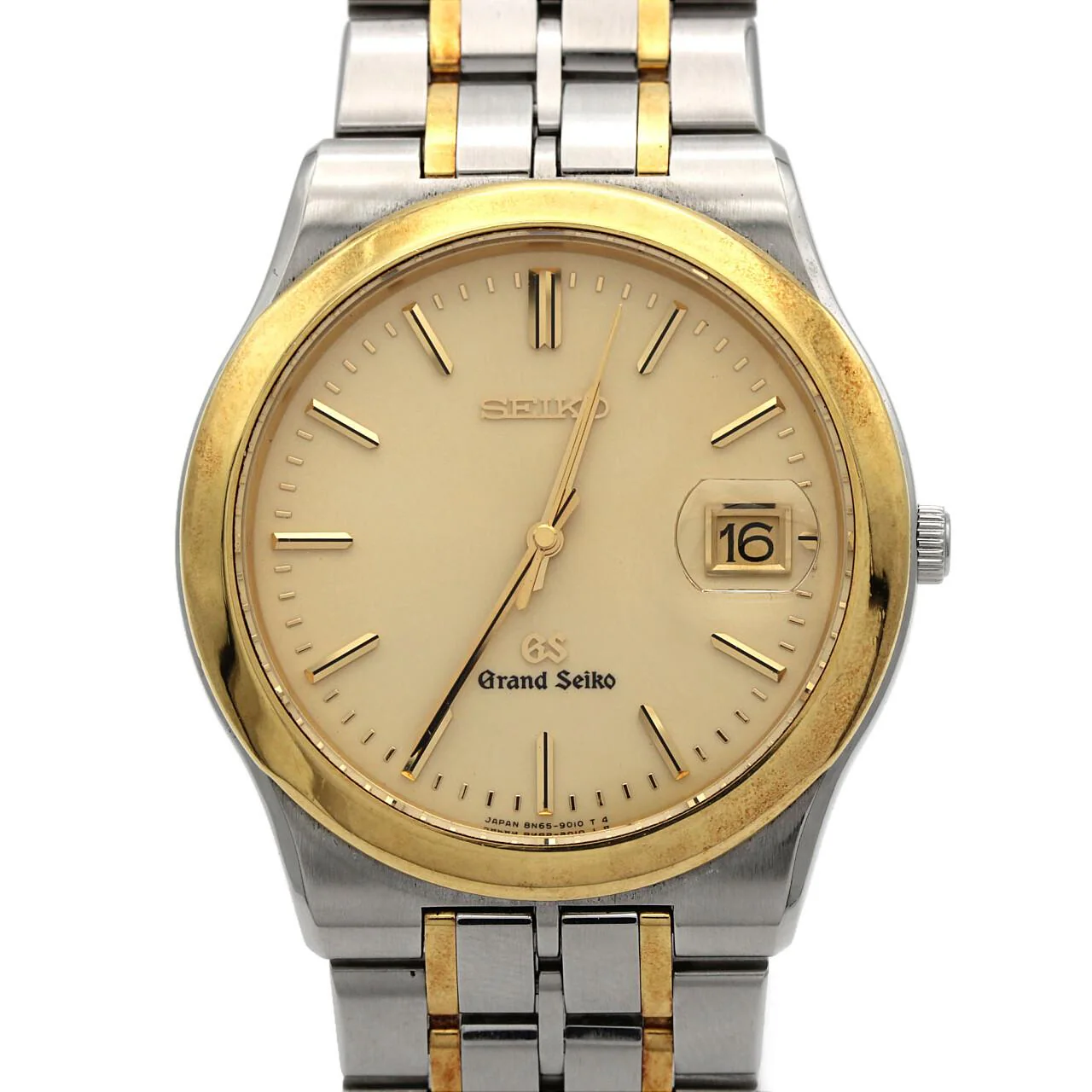 Two-tone wristwatch with steel and gold bracelet links, pale dial, baton markers and date window.
