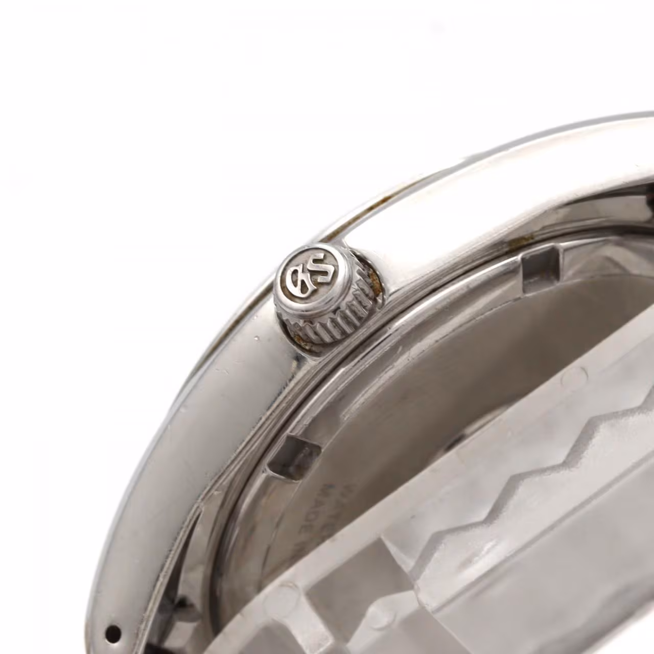 Stainless steel wristwatch with a light dial, baton markers and a matching steel bracelet.