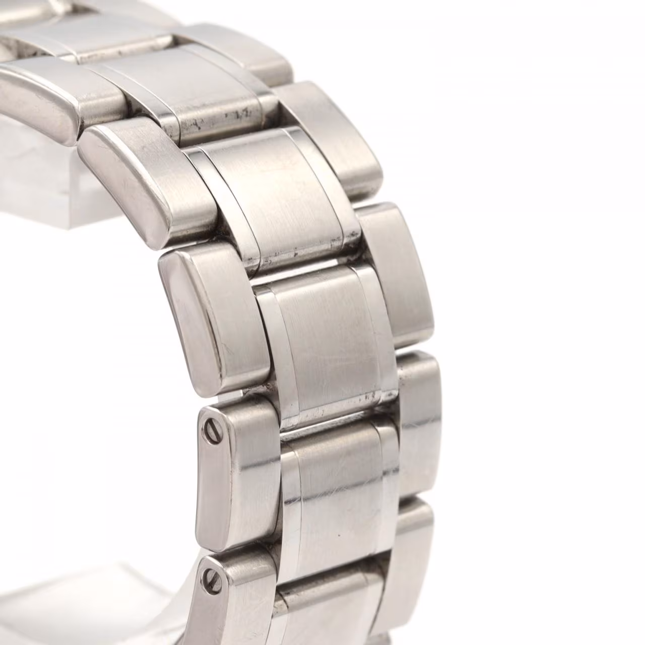 Steel wristwatch with pale dial, date window and polished steel bracelet.