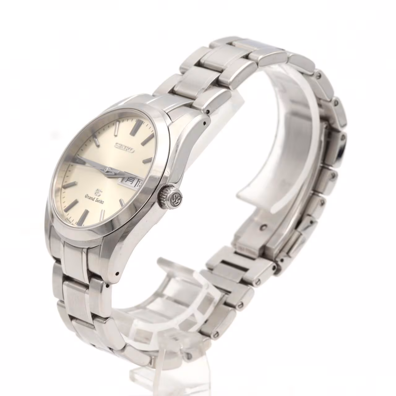 Steel wristwatch with pale dial, date window and polished steel bracelet.