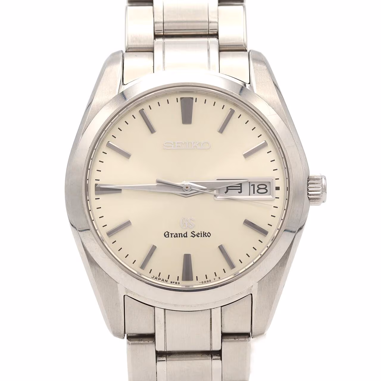 Steel wristwatch with pale dial, date window and polished steel bracelet.