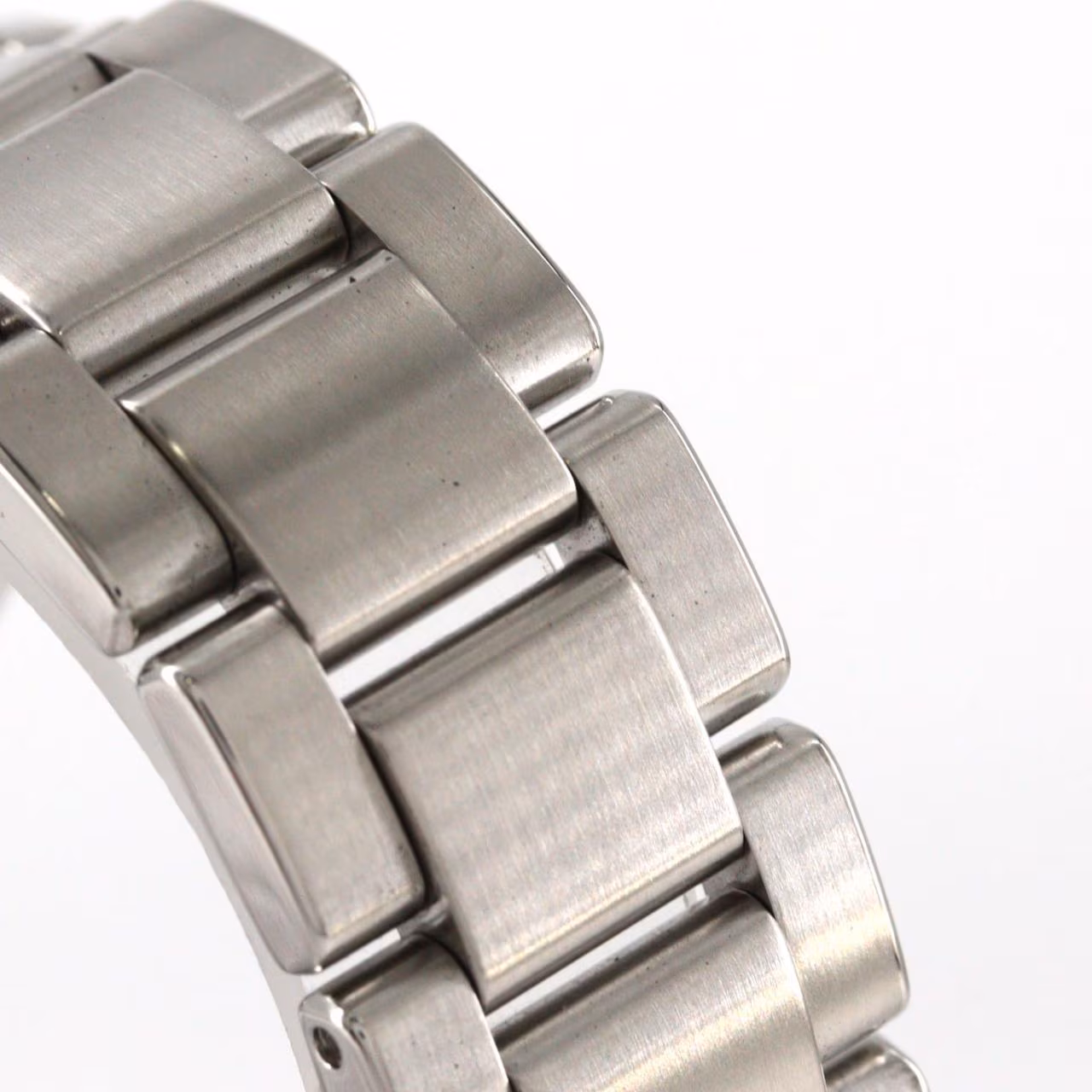Stainless steel wristwatch with polished case, simple dial and steel bracelet.