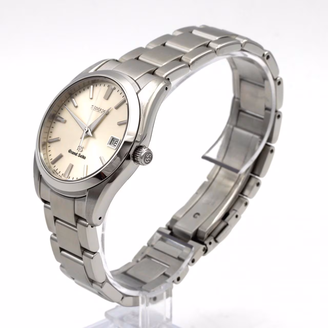 Stainless steel wristwatch with a silver dial, date aperture and a polished steel bracelet.