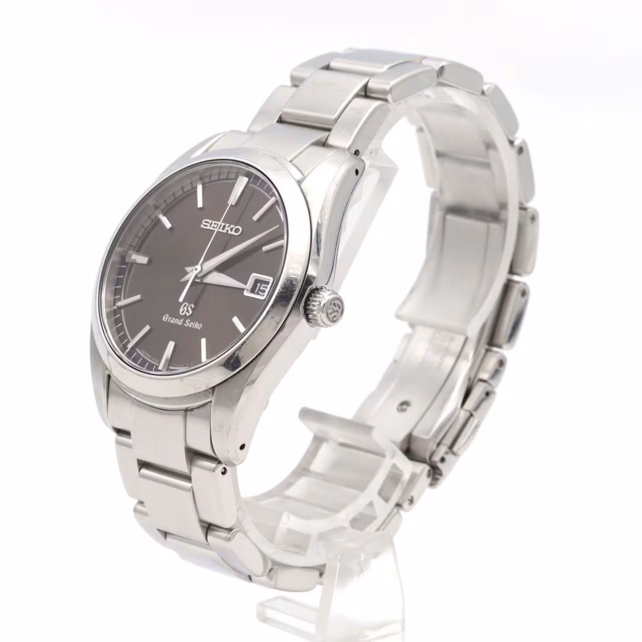Stainless steel quartz wristwatch with a pale dial and steel bracelet.