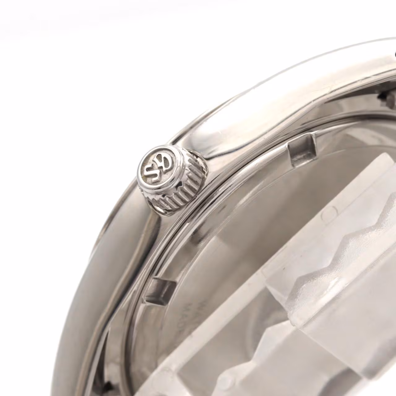 Stainless steel quartz wristwatch with a pale dial and steel bracelet.