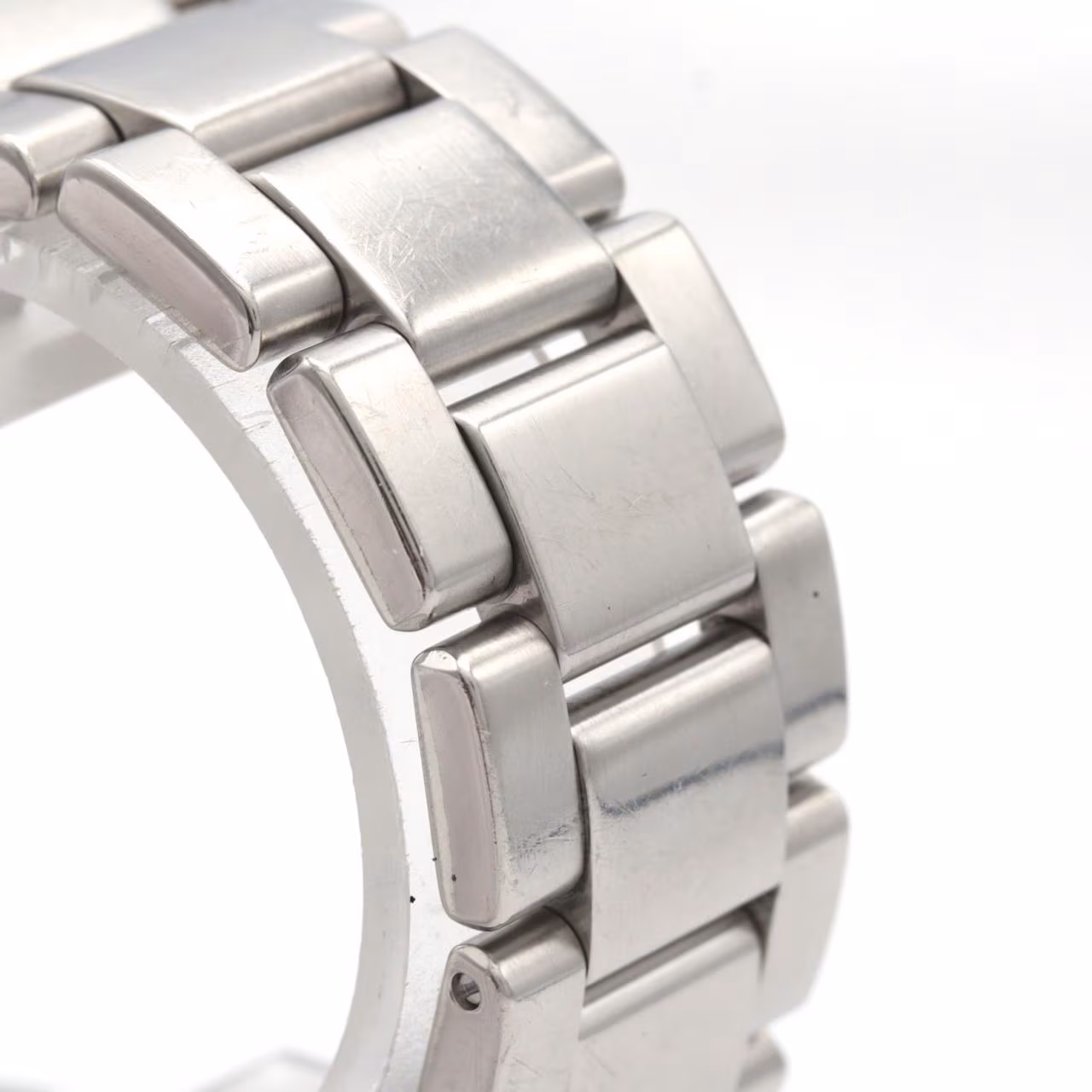 Stainless steel quartz wristwatch with a pale dial and steel bracelet.