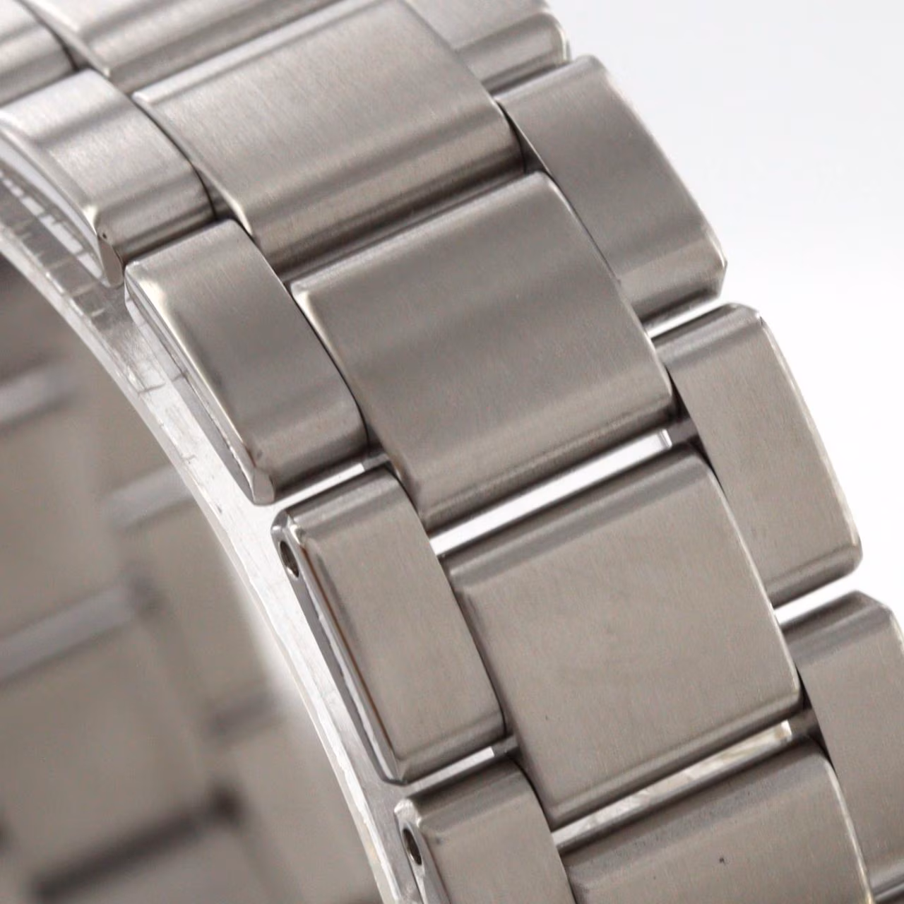 Steel automatic wristwatch with matching bracelet and a date window.