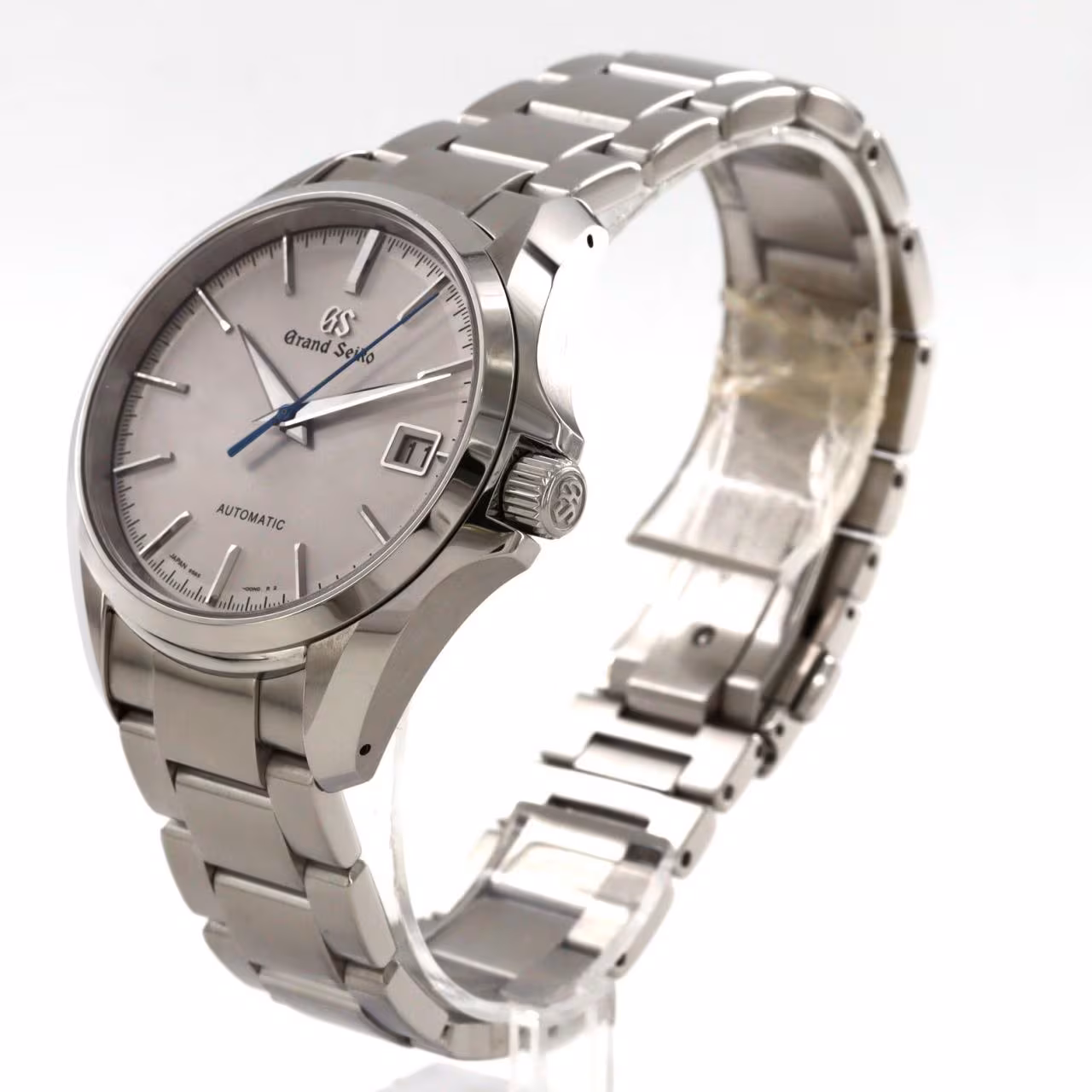 Steel automatic wristwatch with matching bracelet and a date window.