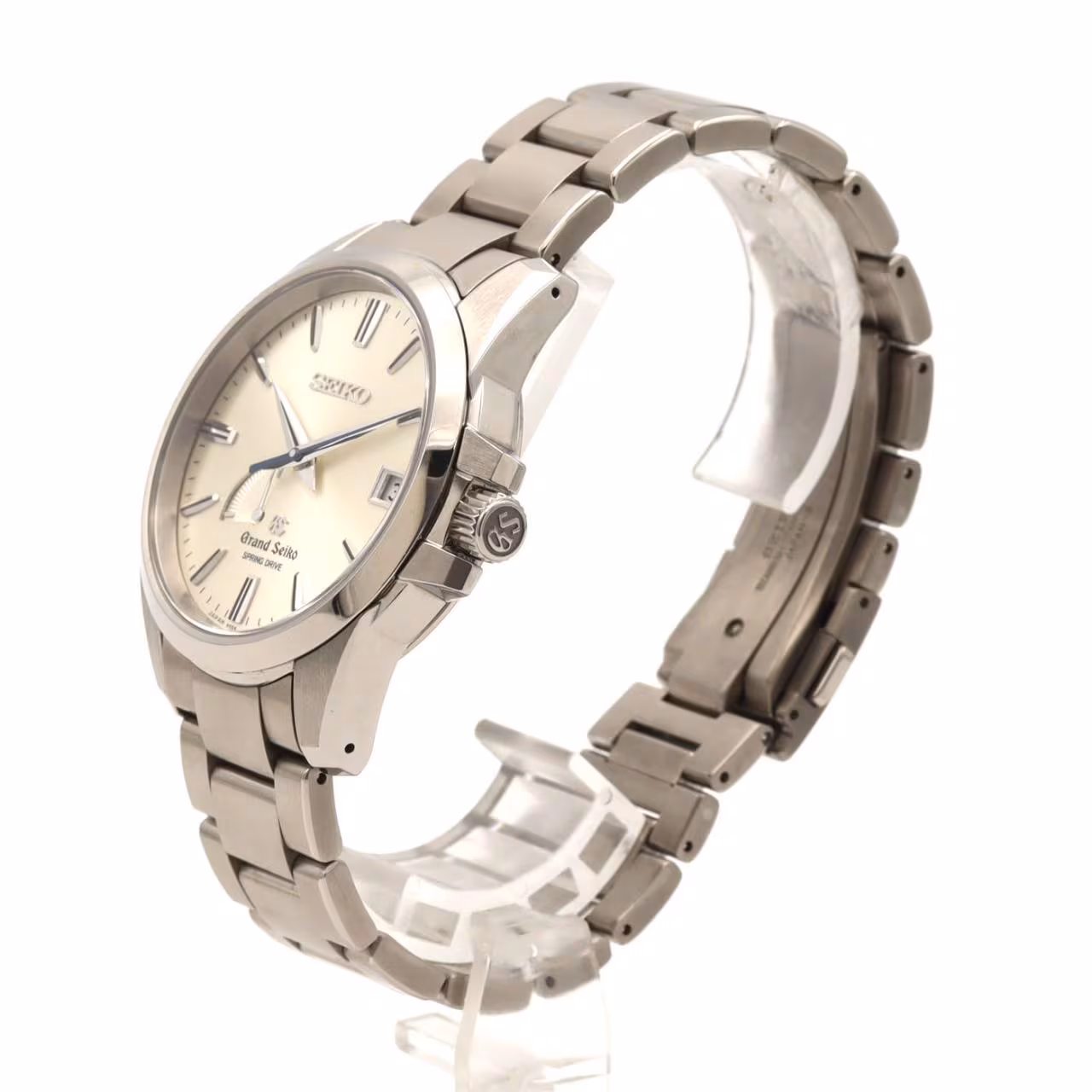 Titanium wristwatch with a light dial, power reserve indicator, date window and brushed bracelet.